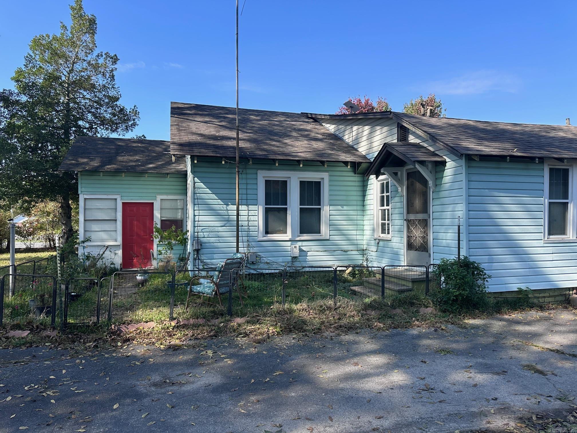 Built in 1939, this house has that old time flair and is well built.  It has a nice spacious back porch for sitting and enjoying your morning coffee while watching the squirrels play in the pecan trees in the backyard.  The backyard provides ample space for flowers and gardening.  This property is zoned for both residential and commercial.  Roof, furnace, and AC were all replaced in 2018.