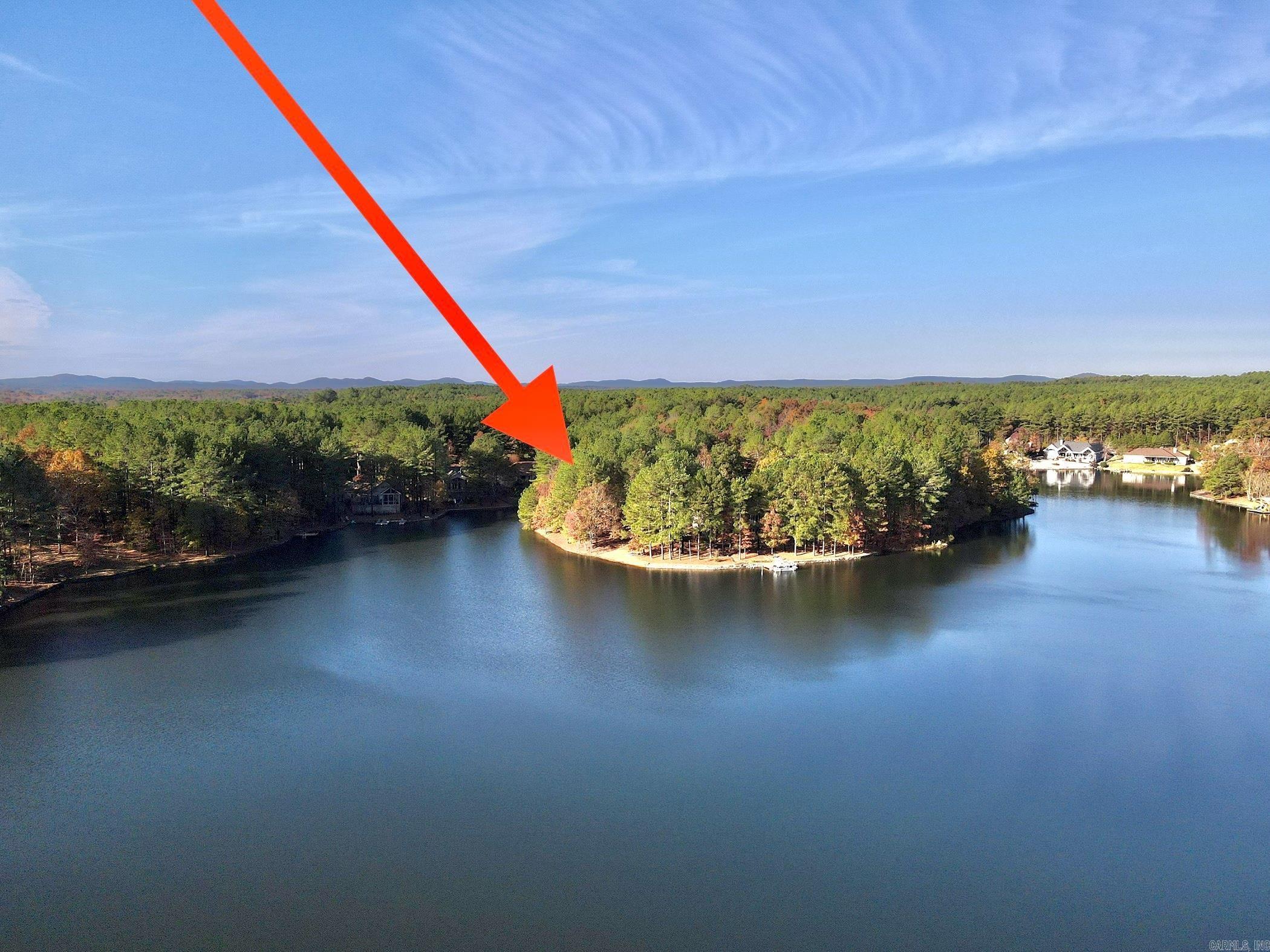 Lake front lot with gentle slope, private pebble beach, and approximately 170' of lake frontage on East side of Hot Springs Village. Located at the end of street on lovely Lake Estrella, which does not receive any golf course run-off water so it's great for swimming! Lot is very close to Granada and Isabella Golf Course. Orientation provides a beautiful, open view of lake. Come build your dream home in Hot Springs Village! New Member Buy-in Fee Due at Closing. See Agent Remarks.