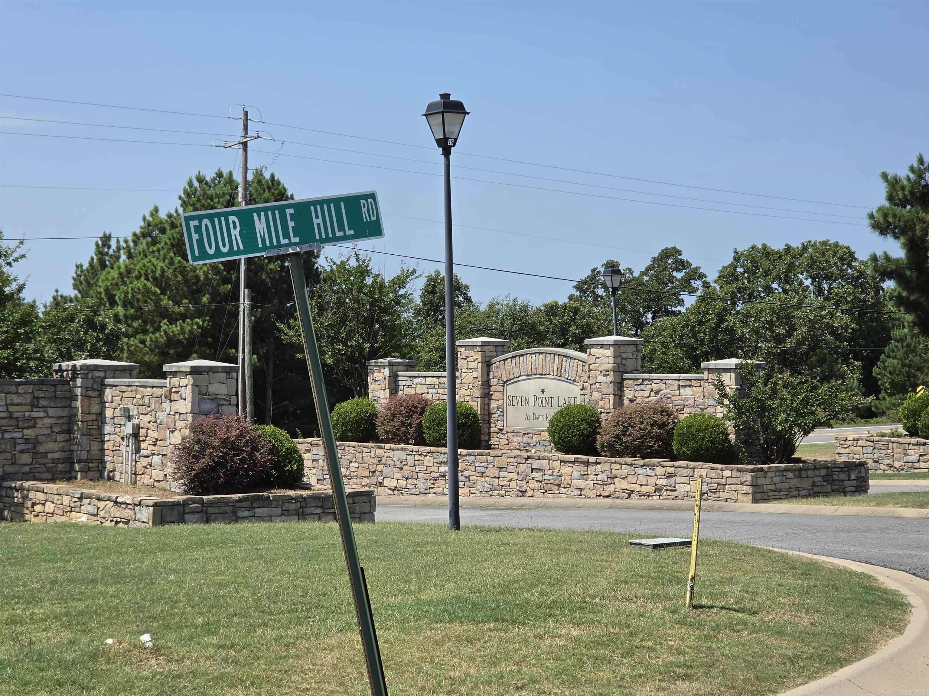 Enjoy breathtaking panoramic views from this exceptional 1.04-acre restricted homesite in the beautiful Seven Point Lake Subdivision. Located within a private gated community, this premier lot offers an incredible 50-mile view, providing the perfect backdrop for your dream home. The subdivision features underground utilities, including city water, natural gas, community sewer, fiber-optic internet, and electric service, combining modern convenience with natural beauty. Surrounded by scenic landscapes and upscale homes, this spacious homesite offers privacy, security, and stunning vistas in one of the area's most desirable lake communities. Conveniently located between Conway, Vilonia, Cabot, and Little Rock Air Force Base, this property offers the perfect balance of peaceful lake-area living and easy access to shopping, dining, employment centers, and everyday amenities. Don't miss this rare opportunity to build in a premier location with unmatched long-range views and modern utilities already available.