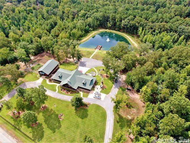 Ever wanted your very own Resort? Ranch? Special Getaway? Dream Home? Here is your best chance to have it ALL! Custom Designed Log Home with TOP of the line Everything...you must see it to believe it! Only 2 miles from Lake DeGray, 21 acres comes with a POND! Floors are hand-scraped Hickory, knotty pine ceilings direct from Colorado, Alder wood doors, Aspen wood cabinets. Full Stone Masonry Fireplace vented to heat the house. Thermador appliances, warming drawer, bar fridge, ice maker, quartzite counters