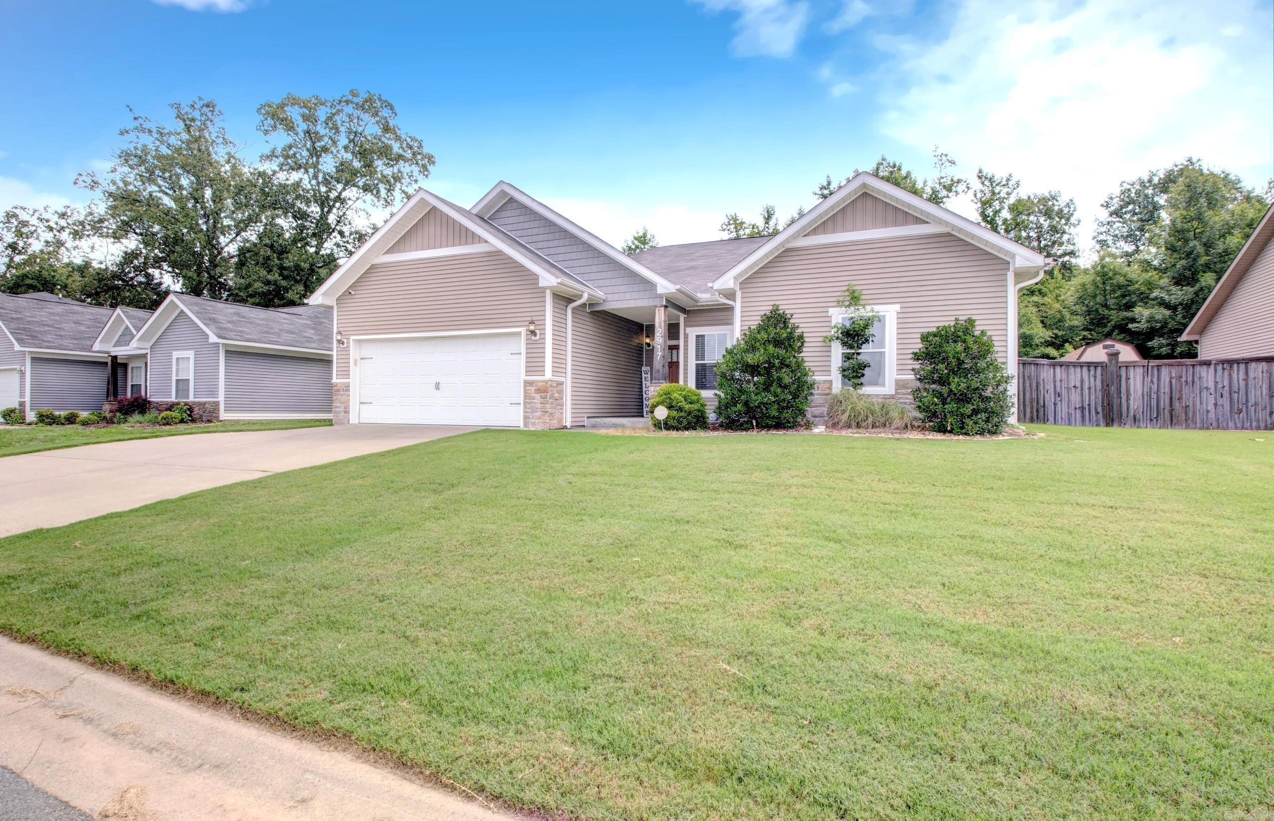 Very well-maintained and exceptionally clean, this move-in-ready home is waiting for its next owner to make it their own! Offering 4 bedrooms and 2 full baths, this home features a HUGE great room with soaring 9-foot ceilings and beautiful plank flooring throughout the main living areas. The kitchen is both stylish and functional, showcasing gorgeous cabinetry colors, granite countertops, an attractive backsplash, and a gas range. Step outside to enjoy the privacy-fenced backyard, providing plenty of space for play, entertaining, or relaxing. Additional exterior highlights include gutters, lush Bermuda grass, and an 18-foot above-ground pool complete with deck, ladder, pump, and supplies that convey with the property (see agent remarks for details). Conveniently located in a desirable Benton neighborhood, you'll be close to schools of all grade levels, parks, shopping, dining, and more. Agents See Remarks