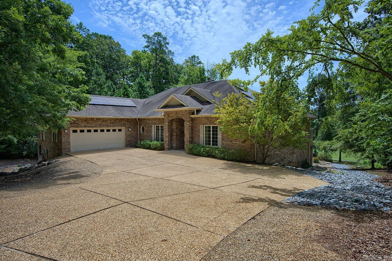 Exceptional custom 4,000 sq ft home of thoughtfully designed living space on a private 0.68-acre lot overlooking two fairways of Magellan. Designed for both elegant entertaining and comfortable everyday living, features an impressive chef’s kitchen with abundant workspace (15' island, Thermador 6 burner gas cook top and griddle) double ovens & dishwashers, tons of additional storage and counters including a prep area with separate sink. The kitchen overlooks the light-filled sunroom. The handsome library features shelves for more than 1000 books ideal for a home office or reading retreat.   The main level also includes luxurious primary suite featuring his/her bathrooms & closets, guest room & bath, LR, and DR.  Fireplaces on both levels create warm, inviting living spaces. Downstairs also has another bedroom/bath, family room, media room and storage room.    Step outside to your private backyard oasis featuring an in-ground pool with sweeping fairway views. Solar panels provide more than 60% of energy needs while also providing insurance during storms.  An attached oversized 2 car garage, and great craftsmanship complete this one of a kind home.