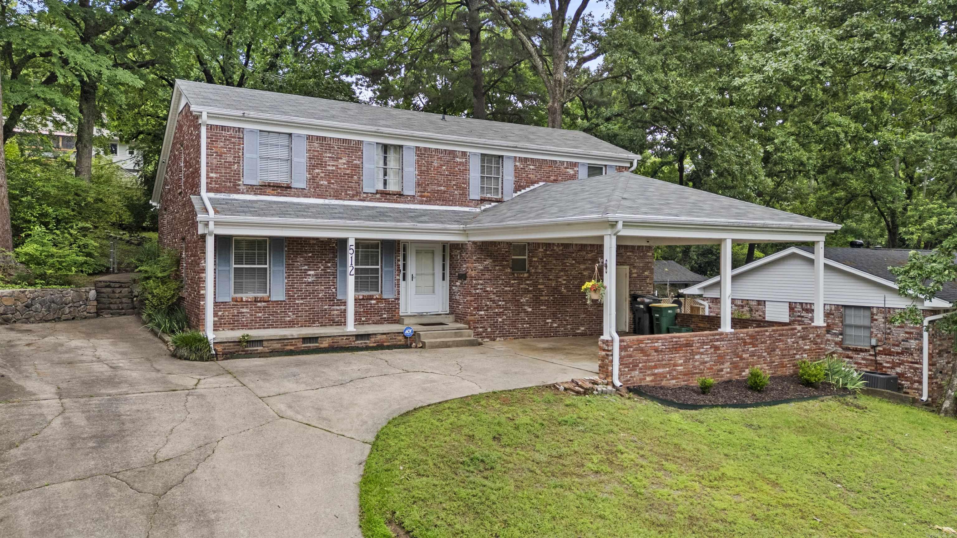 Welcome to 512 N Coolidge Street in the heart of Little Rock! This spacious and updated 4 bedroom, 2 bath home offers over 2,100 square feet of living space.  The layout features multiple living areas, providing flexibility for entertaining, relaxing, or working from home. The floor plan offers a functional flow with a main-level primary bedroom and ample space throughout, including a large backyard and a floored attic for additional storage, and 3 bedrooms along with a full bath on the second floor.  Recent updates make this property truly move in ready, including all new interior paint, a new roof (2024), updated luxury vinyl plank flooring, new back patio, French drain and more! These improvements blend modern style with the home’s solid construction and classic charm. Situated on a 0.22-acre lot, this property offers plenty of room for outdoor enjoyment along with convenient parking.