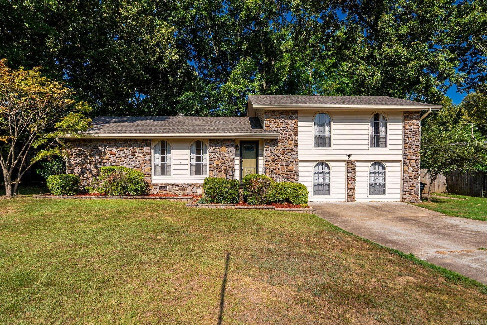 Long-time family home offering incredible space, great bones, maintenance-free exterior & endless potential!This spacious home features 3 living areas,providing flexible space for a game room,media room,home office, additional family room or 4th Bedroom.The updated kitchen offers granite countertops, custom cabinetry w/pull-out drawers,ceramic tile flooring & tile backsplash.The inviting living room showcases a beautiful rock fireplace with a wood-burning stove insert.Major updates include a brand-new architectural shingle roof & HVAC that’s approximately 4 years old. Bathrooms are well maintained & ready for your personal touch.Situated on nearly ½ acre, the property features a huge fenced backyard w/mature trees,large wood deck& a storage building.Located in a quiet,established neighborhood with convenient interstate access, this home is perfect for buyers looking to build equity while enjoying generous living space and a fantastic lot.Don’t miss this opportunity to make it your own!