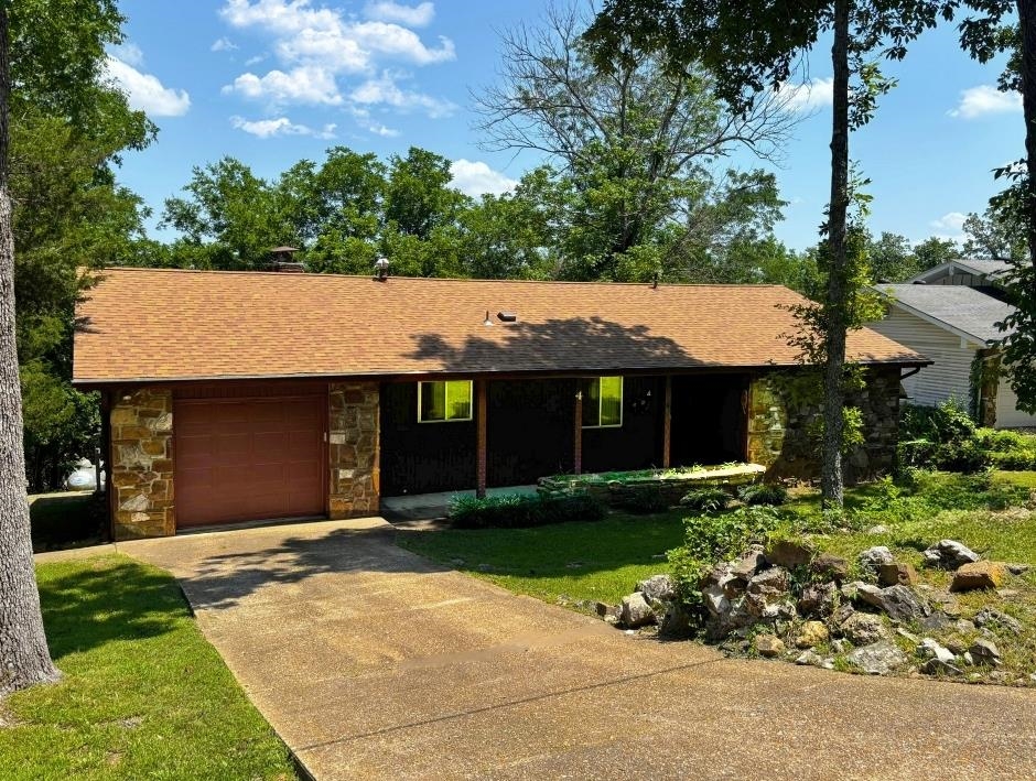 Welcome to 4 Otter Drive in Cherokee Village, a charming two-bedroom, one-bath home with a one-car garage located just minutes from the town center. This property offers excellent convenience while maintaining a quiet residential setting. Inside, you’ll find beautiful woodwork and trim that add warmth and character throughout the home. THICK HARDWOOD under the carpet. Vaulted ceilings. While some updates may be desired, the property is in great condition and has been well cared for. Recent improvements include a brand-new water heater and a new roof, giving peace of mind to the next owner. With its desirable location and solid features, this home presents a wonderful opportunity for comfortable living or investment in the heart of Cherokee Village.