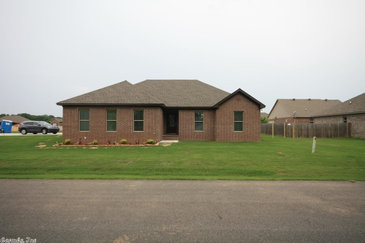 Make an acceptable offer by end of August and get $3000 of closing costs paid by builder!!!! New construction w 3BR + office that would make great 4th BR, open floor plan with cust cabinets, SS appl, granite counter tops.  Beautiful stained concrete floors w carpet in bedrooms, gas log FP, tankless HWH, side entry garage, fenced yard, lots of extras to help keep utilities low such as extra insulation, solar board in attic, 14 seer gas HVAC. Vilonia Schools