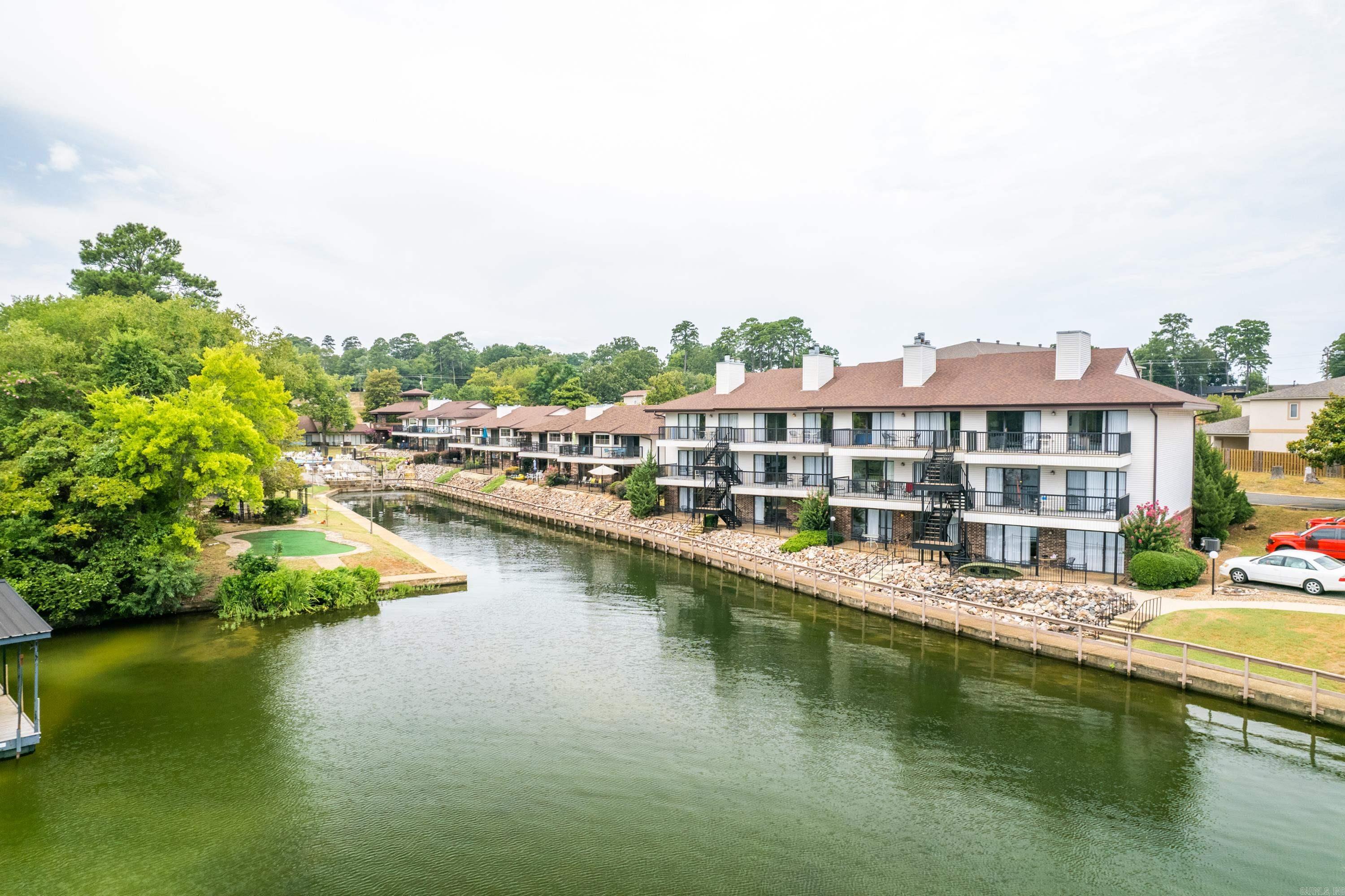 This Condo on the Lake has it All, Open Floor Plan with 2B/2B, Great Lake Views, 1st Floor Unit Fully Furnished. Amenities Include: Beautiful Pool & Hot Tub, Fire Pit & Private Beach, Enclosed Pickleball, Basketball & Sand Volleyball Courts. Outdoor Grilling in Multiple Picnic Areas. Marina & Private Boat Launch. Located 7-Minutes from Oaklawn Racetrack & Casino, Downtown, Shopping & Fine Dining. Short Term Rentals Allowed.