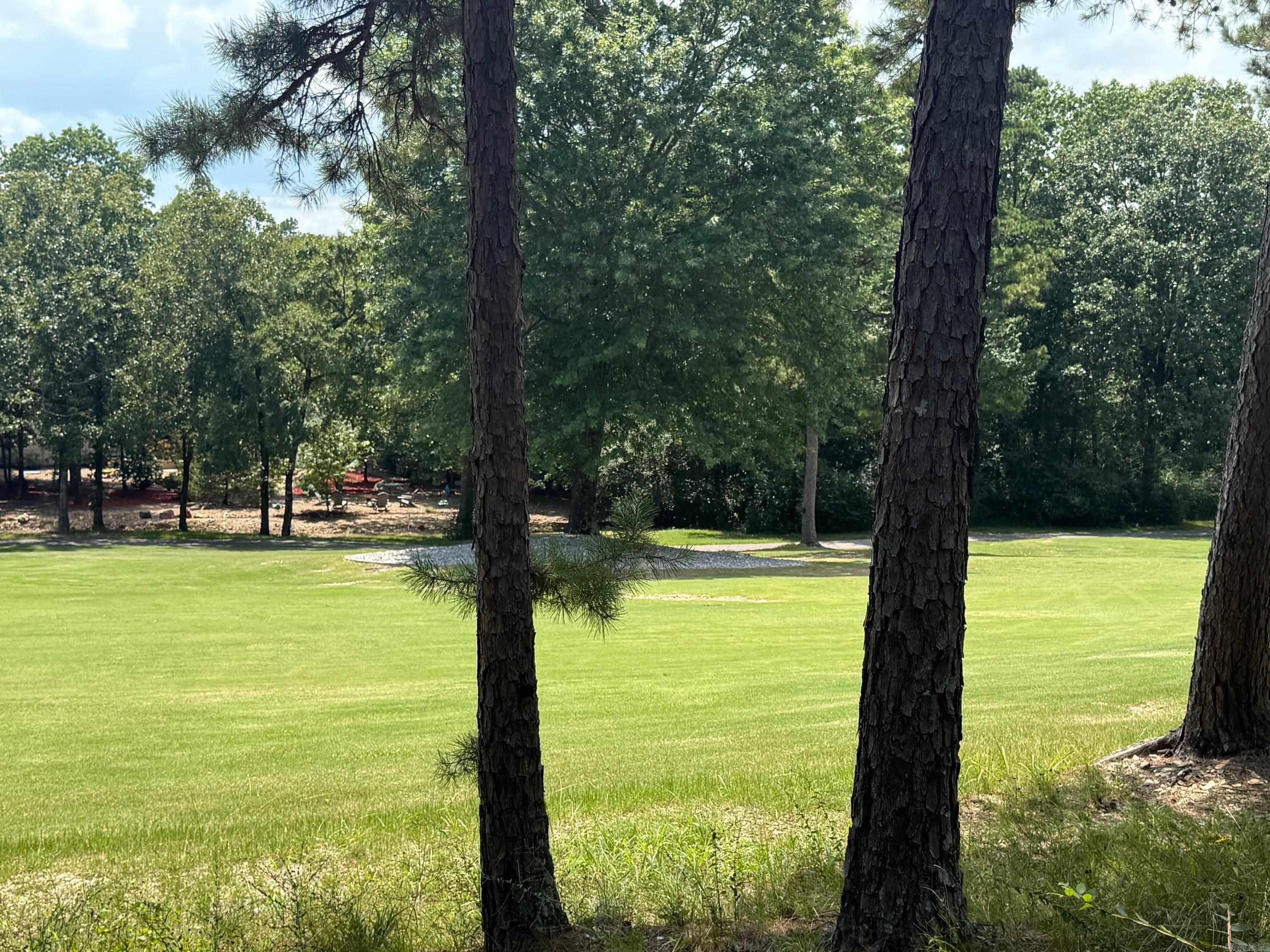 Build the home you've always envisioned on this beautiful cul-de-sac lot in the highly sought-after Hot Springs Village. Surrounded by mature trees and offering a gently sloping landscape, this property provides the perfect balance of privacy and natural beauty. Enjoy the convenience of being just a short walk from the renowned Coronado Golf Course and Clubhouse, with easy access to fitness facilities, scenic walking trails, lakes, restaurants, and the many amenities that make Hot Springs Village one of Arkansas's premier communities. Whether you're ready to build your dream home or looking for a smart investment opportunity, this property offers an exceptional location and an unmatched lifestyle within the nation's largest gated community.