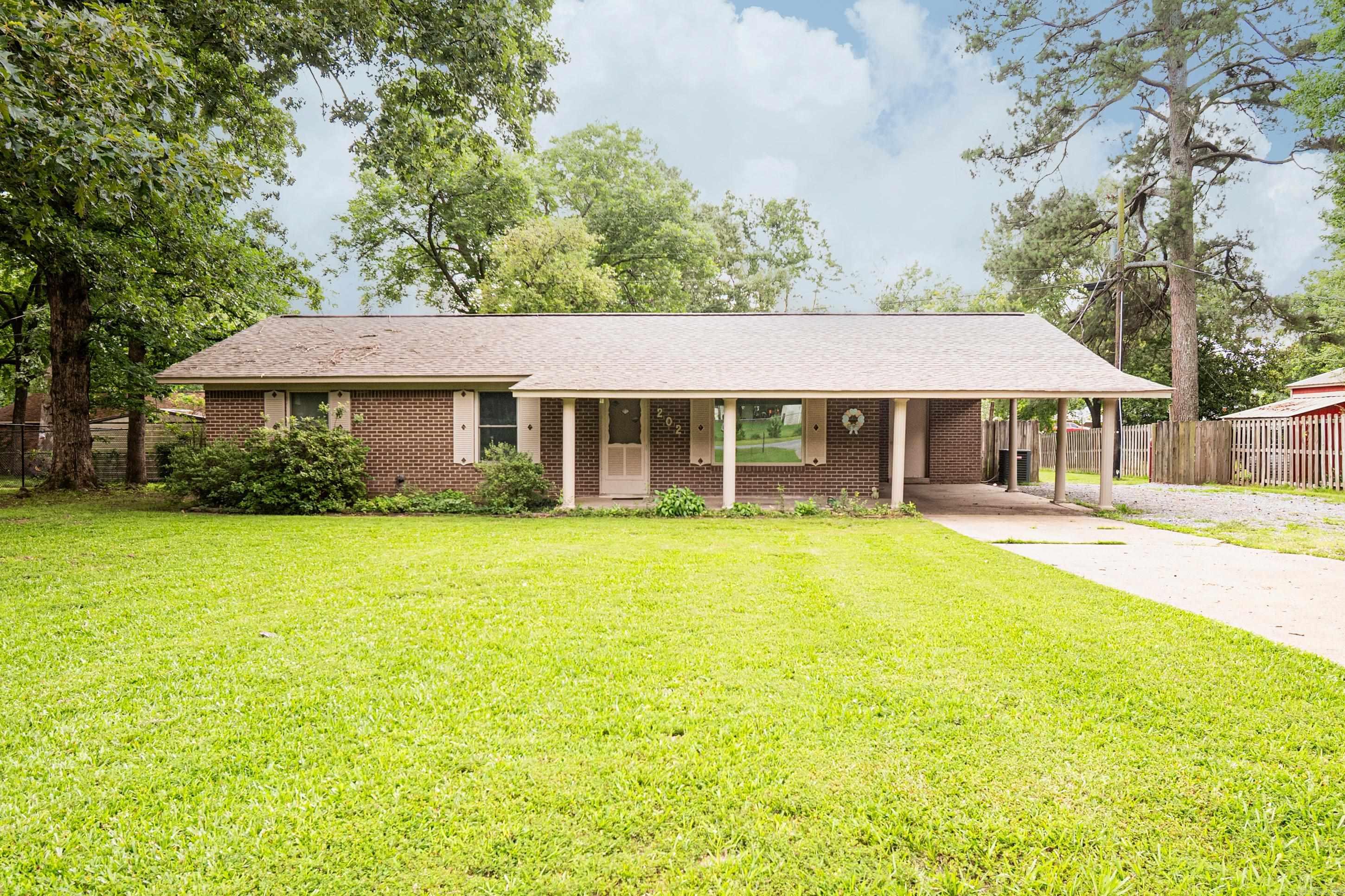 Nestled on a spacious .49-acre lot, this beautiful 3-bed/1.5 bath home is packed with charter and major upgrades. From the moment you step inside, you'll love the custom built-ins adding timeless appeal to the kitchen and master bedroom. The kitchen features all-new appliances and a built-in water filter. Major Upgrades offer a worry-free living: New Windows and Whole-Home Generator (both with lifetime warranties). New plumbing and New Hot Water Tank. Step into your private, wooden-fenced backyard to relax. For hobbyists, the property boasts an impressive, detached workshop featuring a covered side on one end and a lean-to on the other. Washer, Dryer, and Hot Tub convey! Move-in ready- Schedule your showing today! More Pictures Coming This Afternoon