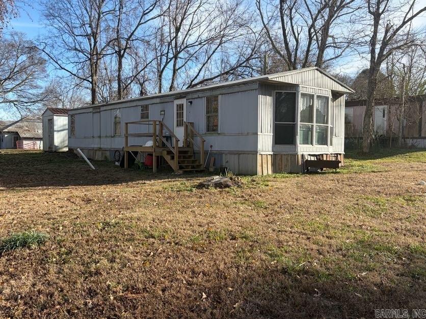 This 2-bedroom, single-wide mobile home sits on a wide corner lot in Hatfield city limits, with city utilities. A great starter home for the price, but it needs a few repairs and some TLC. A storm cellar is conveniently located on the property. The shed does not convey. Property to be sold as is, where is. Agents, see remarks