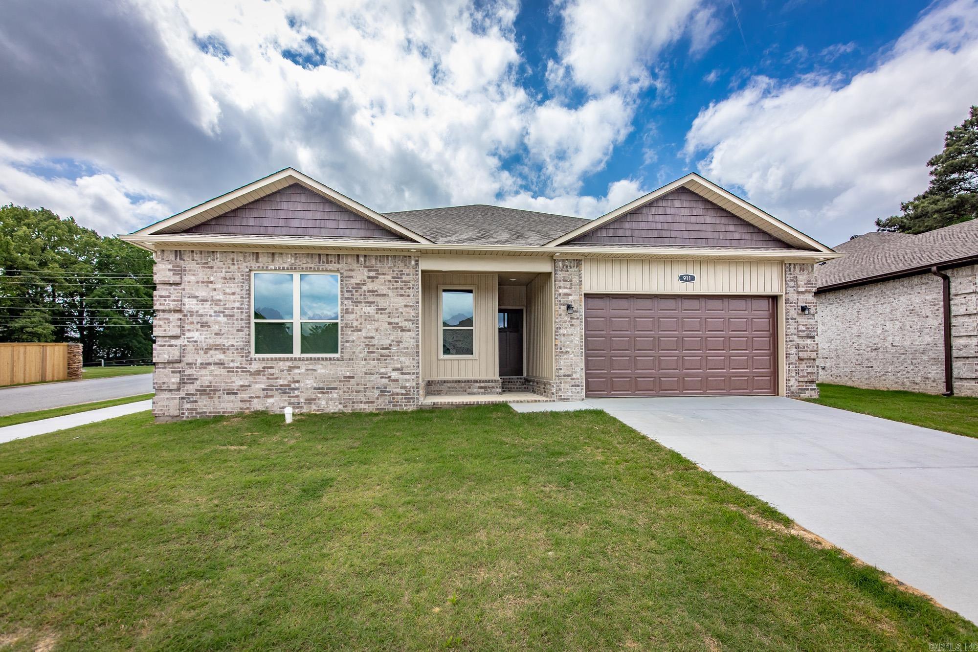 Welcome to this stunning new construction home that perfectly blends modern design with everyday comfort. Featuring 3 spacious. bedrooms & 2 full baths, this thoughtfully designed split floor plan offers both privacy & functionality. Step inside to  an inviting open-concept layout, ideal for entertaining & daily living. The living room showcases a beautiful vaulted ceiling with a striking stained beam. Luxury vinyl flooring throughout the home, complemented by gorgeous granite countertops in the kitchen & baths. Retreat to the primary suite where you'll find a beautifully designed walk-in tiled shower. Situated on a desirable corner lot within a gated community, this home features also covered patio for relaxing and a 2 car garage. With generously sized rooms & high-end finishes throughout, this home offers the perfect combination of style, comfort, and low maintenance living. Seller will pay for the first year of HOA/POA dues !!!