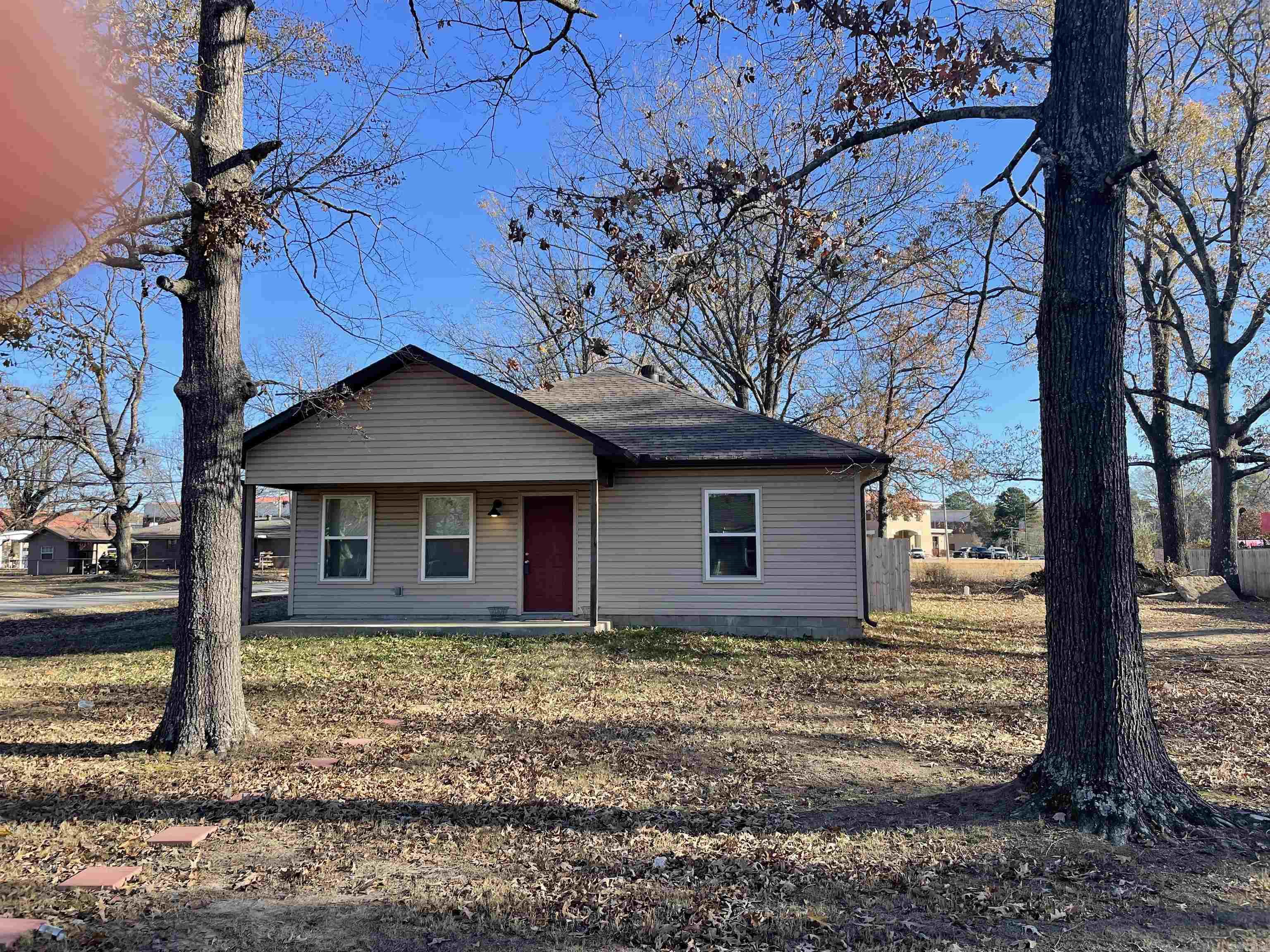 Welcome home to this charming 3-bedroom, 2-bath property in the heart of downtown Cabot, just minutes from shopping, dining, and everyday conveniences. Nestled on a corner lot, this home offers an oversized two-car carport and a spacious backyard that is approximately 80% enclosed with a wood fence, providing plenty of room to enjoy outdoor living. Inside, you’ll find luxury vinyl plank flooring throughout, a well-appointed kitchen complete with all appliances and a custom backsplash, and a convenient mudroom just off the carport with a storage nook and washer/dryer hookups. The primary suite features a private en-suite bath and an oversized closet, while ceiling fans in every room add comfort and style throughout the home.