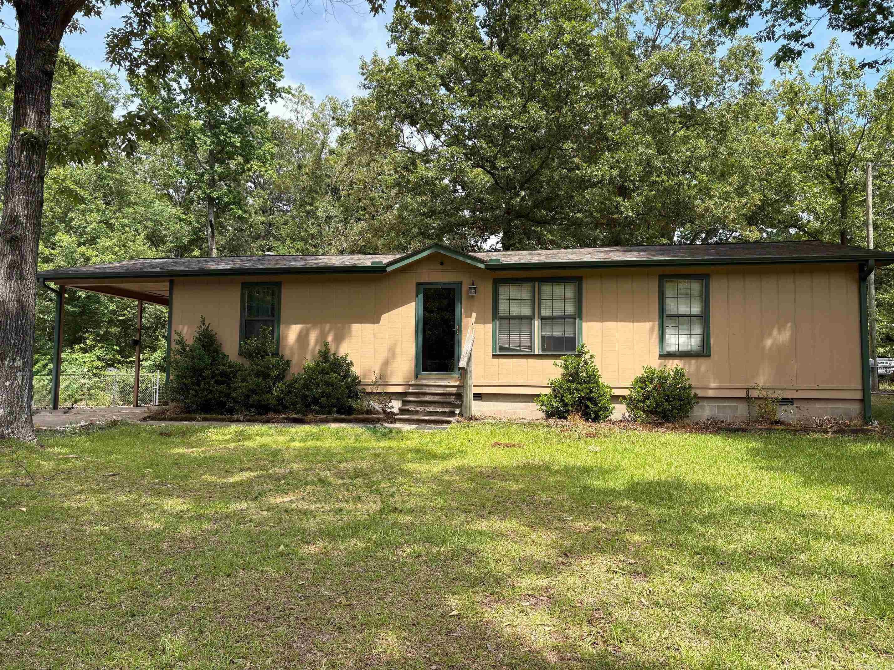 Experience country living just 30 minutes from downtown Little Rock with this charming three-bedroom, two-bath home situated in a rustic setting. This gem rests on over half an acre of beautiful, level land with a fenced-in backyard. You’ll appreciate the spacious backyard, which is perfect for gatherings and features a large deck ideal for entertaining. Additionally, there is an impressive 40x40 shop equipped with electricity, water, a half bathroom, and a loft for extra storage or workspace! With new flooring in kitchen and plenty of updates, this home is ready for its new owner. Come take a look today!