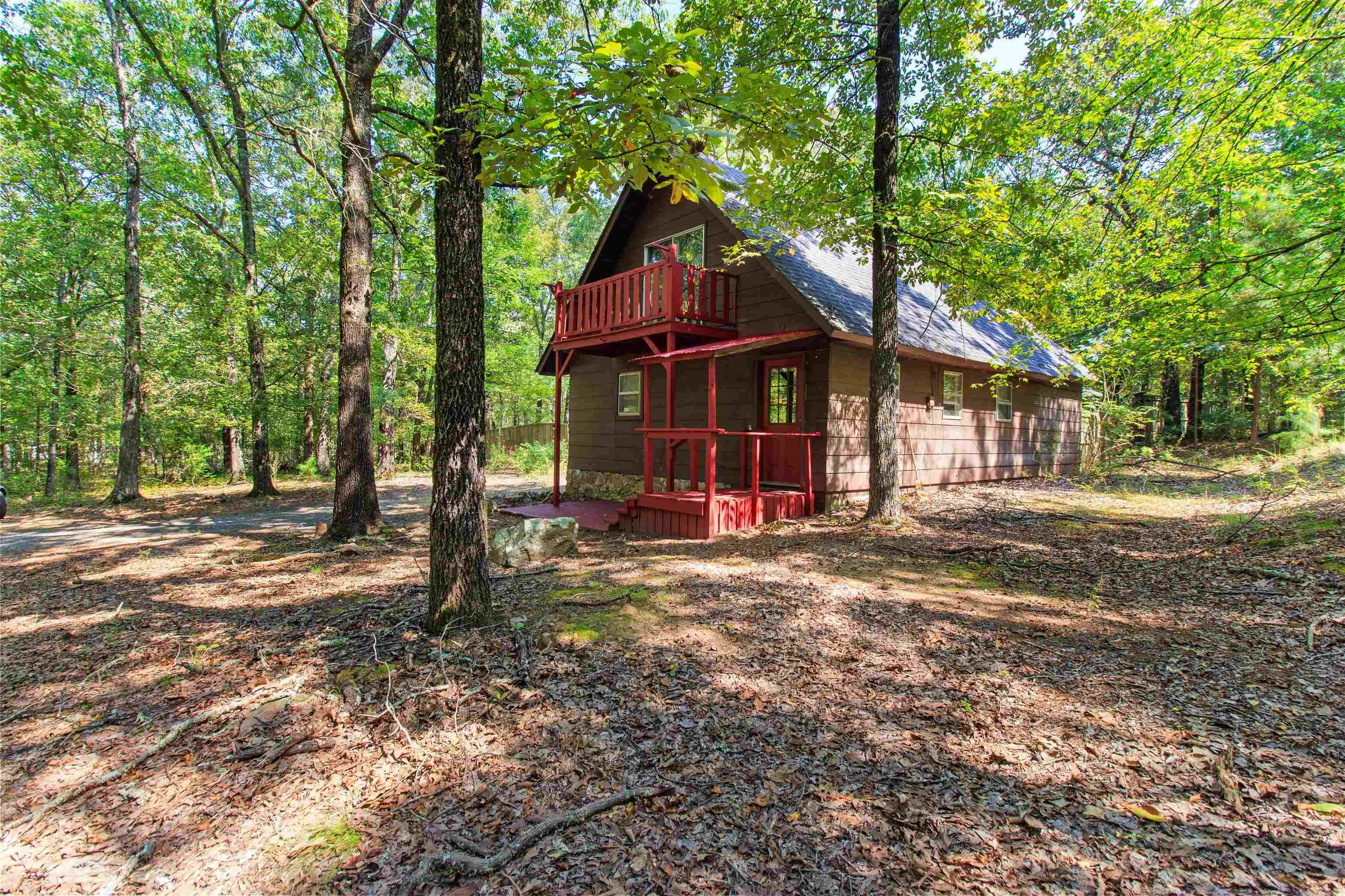 Serenity awaits you at this charming, secluded forest retreat. Only 20 minutes from Conway and 12 minutes from all of the amenities that Cabot has to offer lies your quintessential cabin on an acre and a half of deer woods. Nestled down a long, gravel path, you can hear only the sound of birds and leaves. Have a sip of coffee each morning from your balcony, or entertain guests on your back porch. This cabin features a fully fenced backyard, large laundry and storage area, and plenty of upstairs space for a gym, home office, separate bedroom, or game room. If you want to get away from it all while still being close to the comforts of the city, this property is for you! There is a tenant occupying the home who is happy to stay, if you are an investor looking for an immediate income-providing property ($950/mo)! Schedule your showing today!