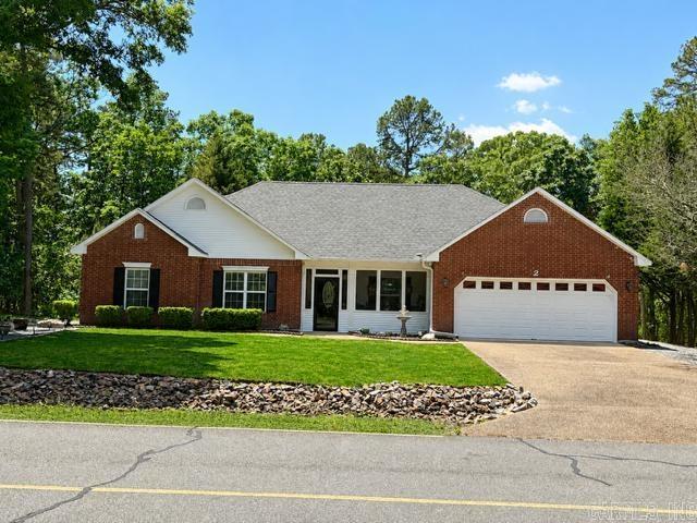Only three words to describe—immaculate, immaculate, immaculate offering a perfect blend of comfort, and natural beauty. This inviting home sits on a generously sized lot, surrounded by mature trees that create a serene, park-like setting ideal for relaxing or entertaining. Inside, you’ll find a thoughtfully designed layout with spacious living areas, and a warm, welcoming atmosphere. The home features comfortable bedrooms, a well-appointed kitchen with ample storage and workspace, and a cozy living room perfect for gathering with family or enjoying quiet evenings. Step outside to enjoy the tranquil outdoor space—whether it’s morning coffee on the deck, watching local wildlife, or hosting weekend get-togethers, this property makes it easy to embrace the laid-back lifestyle Hot Springs Village is known for. Located within one of the nation’s largest gated communities, residents enjoy access to a wide range of amenities including golf courses, lakes, walking trails, fitness centers, and more. Updates: new deck, pergola, and gazebo - 2022; new roof, gutters, spouts, and guards - 2023; new heat and air - 2024; new water heater and plumbing throughout house, and screen porch - 2025.