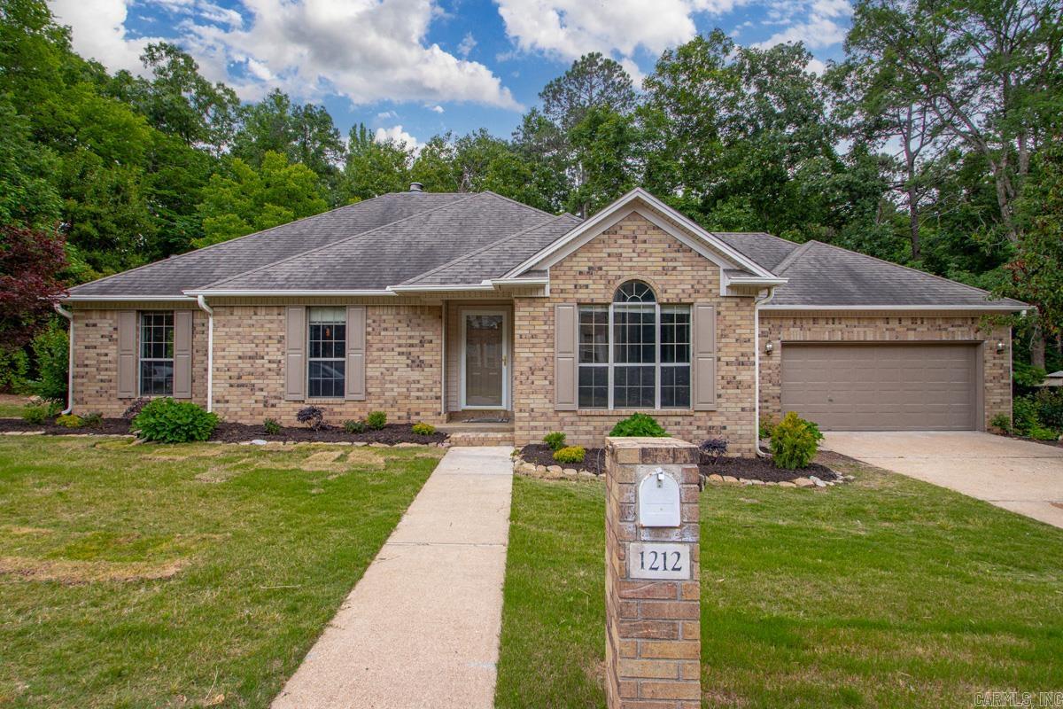 River Oaks Living! Nestled in one of Benton’s most established neighborhoods sits this 3 bed, 2.5 bath home ready for its next owner. Fresh paint and new flooring throughout make this home move-in ready from day one. Step through the front door and you’ll find an elegant dining room to your right. The spacious living room flows directly into the kitchen, featuring new countertops and plenty of room to gather. A half bath and large laundry room complete this side of the home. Down the hall you’ll find two spare bedrooms and a full bath. The primary suite features a Texas-style bathroom with a functional layout and plenty of space. Outside, you’ll notice the fresh landscaping adding to the curb appeal. Out back, the deck is ready for relaxing in a super private setting perfect for bird watching and enjoying all kinds of wildlife.This property also includes a second lot — perfect for gardening, a swing set, additional outdoor living space, or simply extra manicured lawn area. Call today to see this one in person! Agents see remarks.