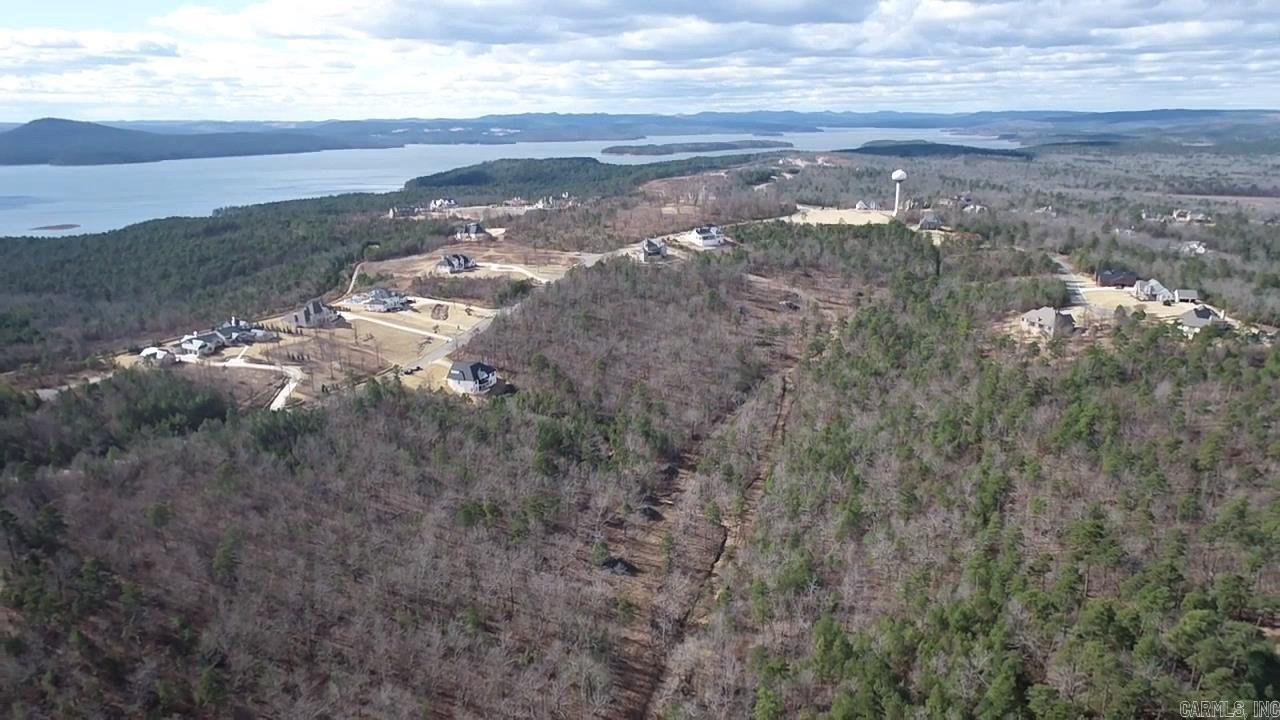 A truly rare opportunity to own 21 private acres inside the gated Waterview Estates subdivision. This exceptional property offers unmatched privacy, abundant green space, and the best of both worlds—seclusion with full access to premier neighborhood amenities.  Enjoy pickleball, tennis, basketball courts, open fields for football and soccer, and miles of scenic nature walking trails, all within the security of a gated community. Properties of this size and privacy inside a subdivision like this almost never come available.  Perfect for those seeking space, tranquility, and an active outdoor lifestyle—without sacrificing community or convenience.