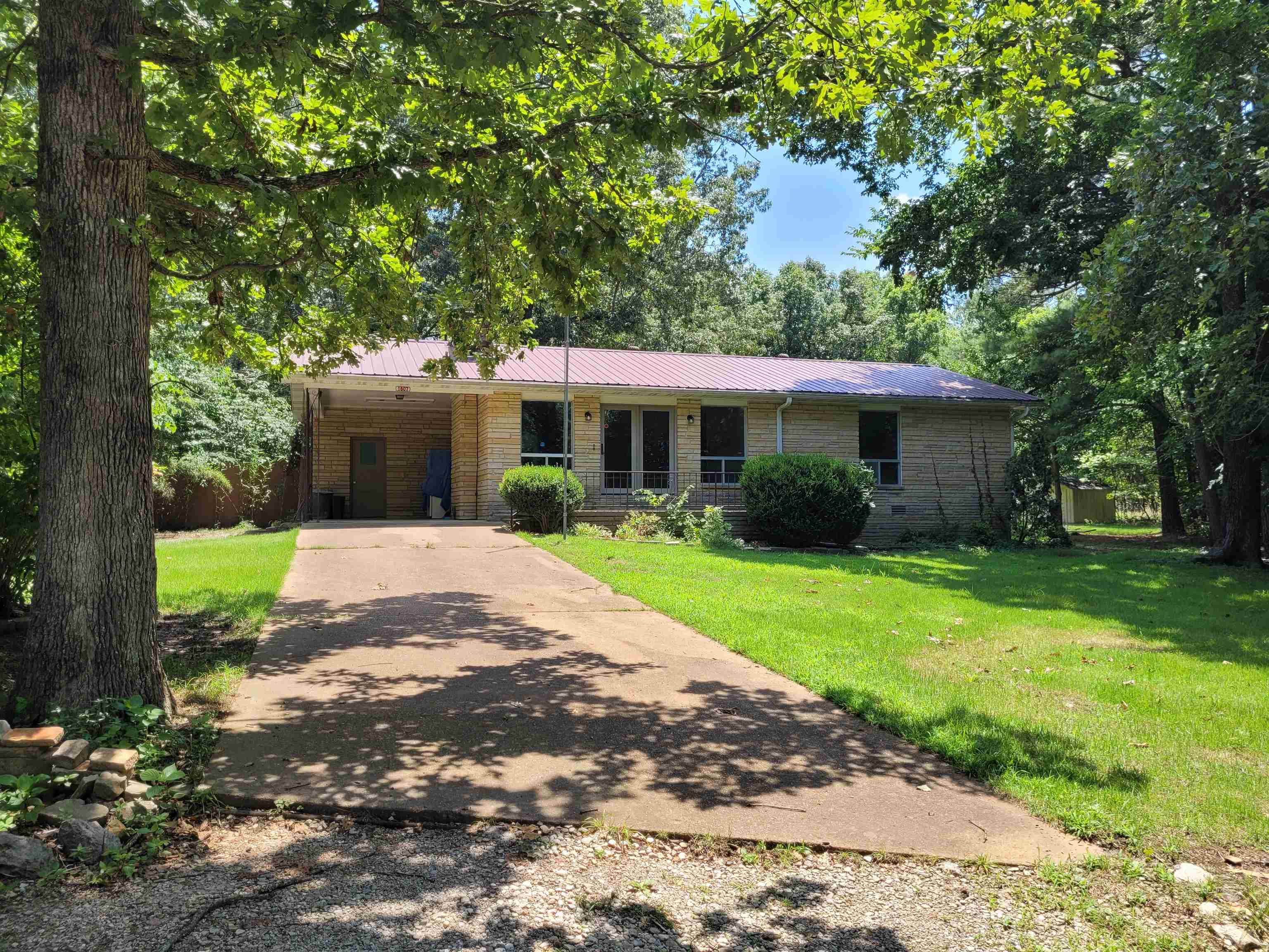 Check out this newly remodeled home in north central Arkansas. This 2 bedroom home has over 1,100 square feet and sits on one lot. With a metal roof and brick exterior, the home is low maintenance. There is a large living room with a fireplace and lots of windows to enjoy the views. From the kitchen, you step down into an airy dining room as well as a bonus room. The bathroom includes a tub and stand up shower. The home has lots of storage and includes a storage room off the covered carport. There is also a partial basement with an exterior entrance. The lot is surrounded by woods, have a shed and a chain link fenced area for pets. The property has a very country feel but minutes to amenities, including several lakes. Come take a look soon! Property sold as-is.