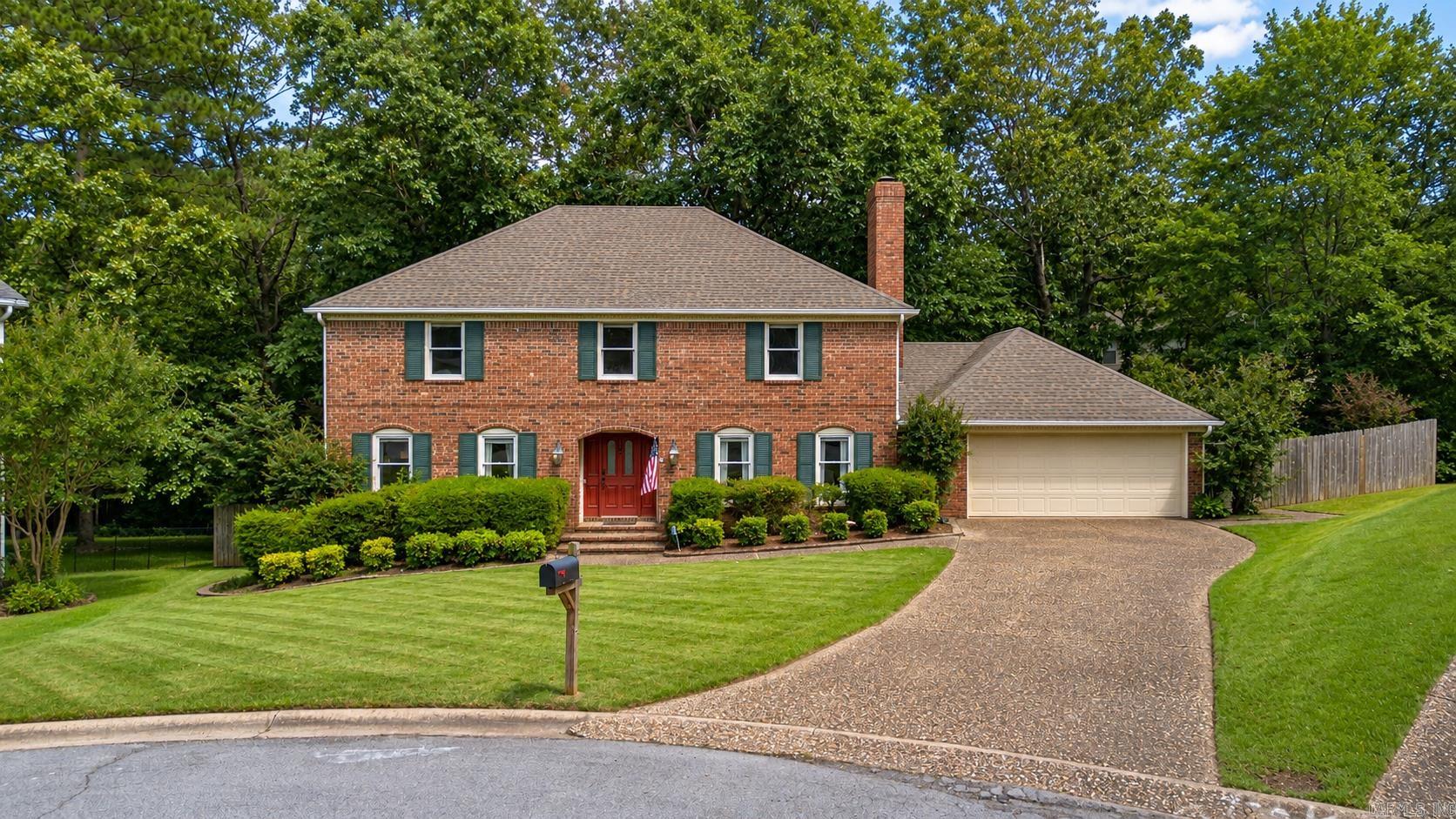 Wonderful opportunity to own this spacious home in West Little Rock, conveniently located near shopping, dining, schools, & everyday amenities, all tucked away in a quiet cul-de-sac. Offering 5 bedrooms and 2.5 baths, the flexible floor plan includes a fifth bedroom that could easily serve as a home office, bonus room, or playroom. The main level features two living areas, formal dining room, laundry room, & a guest bedroom. The inviting family room showcases a brick fireplace, wet bar, built-in cabinetry, and an abundance of natural light. The updated kitchen features granite countertops, tile flooring, fresh paint, undermount sink, & updated fixtures. Beautiful bamboo hardwood flooring flows throughout much of the home, adding warmth and character. Upstairs, you'll find four spacious bedrooms, including the oversized primary suite complete with built-ins and a walk-in closet. The primary bath offers granite countertops & double vanity, including a private vanity area. The secondary full bath has been tastefully updated with a new soaking tub, custom tile surround, plus double vanity. Step outside to a private, tree-shaded backyard oasis.
