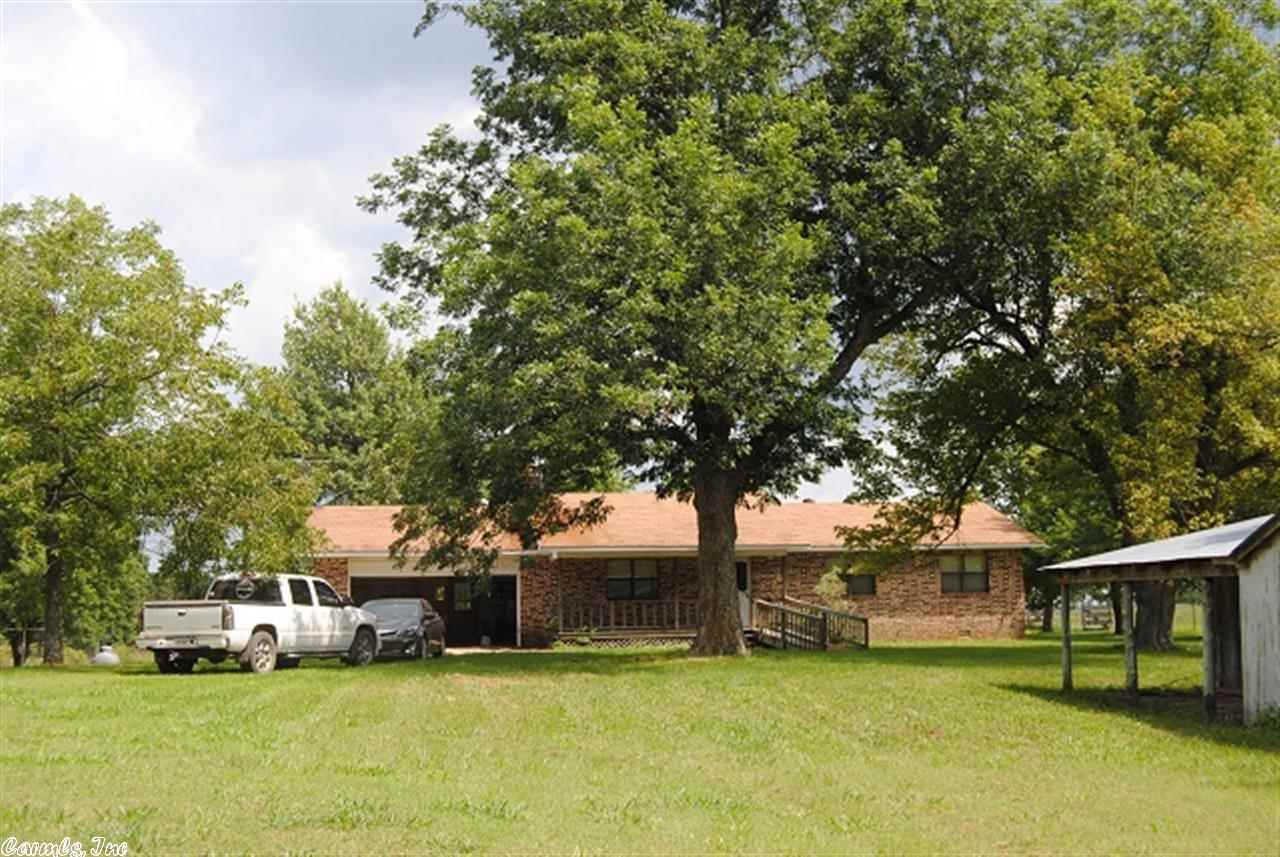 Very nice all brick home sitting on a 80 acres farm. Lots of good pasture and some in woods for wildlife. several outbuilding and sheds, shop , barns, all fenced, 3 bed/2 bath a Fisher Wood insert . Central heating and cooling, sunroom , big flat yard, ready for your livestock and critters, ponds, rural water, well, and a hand dug cistern, fruits trees and grapes, great spot for a garden,  2 car garage ,This is priced to sell, Looking for a good farm to raise a few cows on then this is the one, priced sell