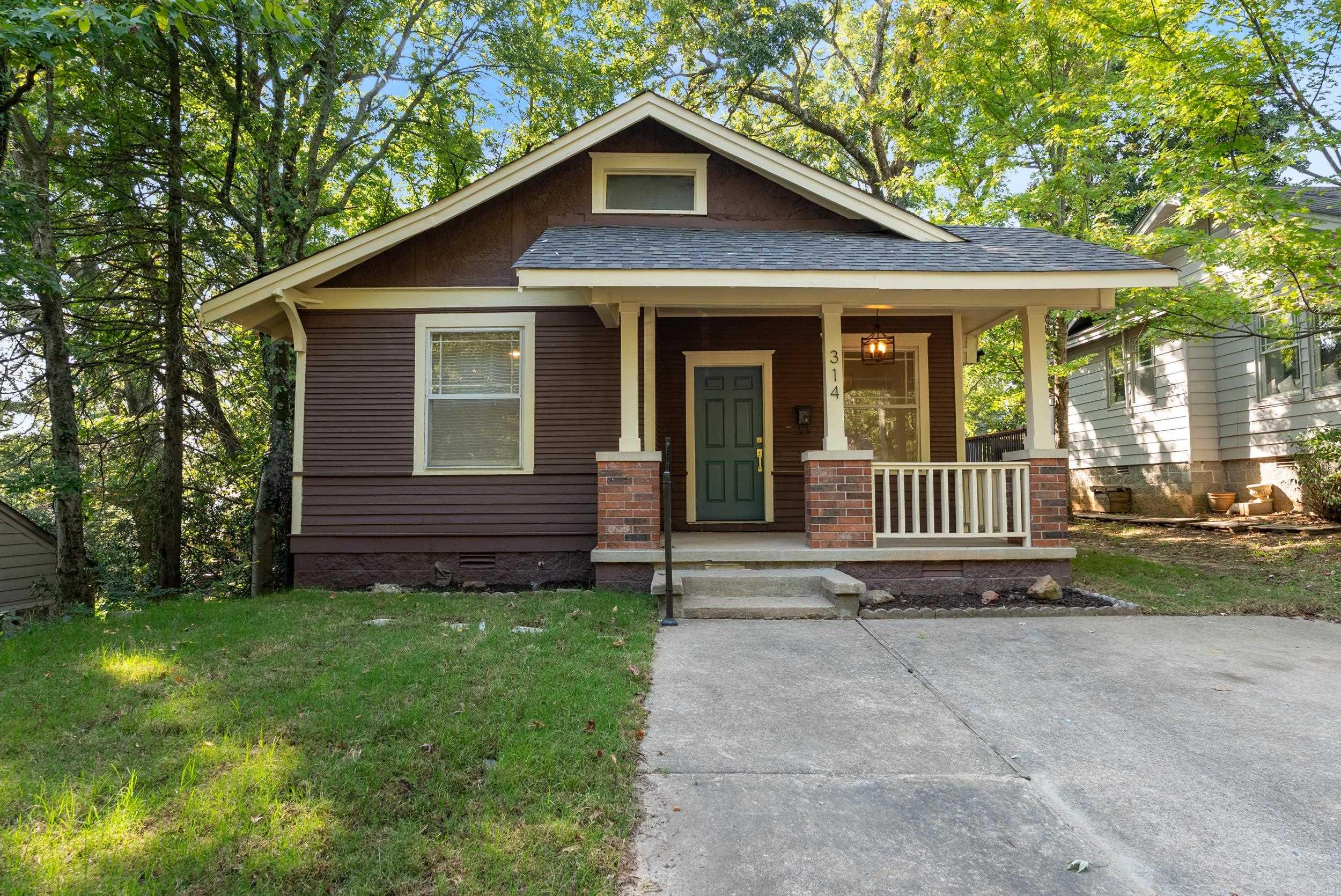 Welcome to 314 Walnut Street, where historic Hillcrest charm meets modern peace of mind. Thoughtfully renovated with a new roof and meaningful updates throughout, this move-in-ready home lets you enjoy the character of a classic bungalow without the renovation to-do list.  The stylish kitchen blends quartz countertops with a tile backsplash, brass accents, and stainless steel appliances with timeless style. Original hardwood floors, light-filled living spaces, two comfortable bedrooms, updated baths, and a versatile bonus room create a home that easily adapts to your lifestyle—whether you need a home office, reading nook, guest room, or creative space.  Step outside to a private deck tucked beneath the trees, then stroll to Lee Avenue, neighborhood coffee shops, parks, restaurants, and everything that makes Hillcrest one of Little Rock's most loved communities.  Perfect for a young professional seeking walkability, a UAMS buyer wanting an easy commute, a downsizer looking for low-maintenance living, or anyone searching for the ideal entry into Hillcrest, this home delivers timeless character, thoughtful updates, and a location that's difficult to match.