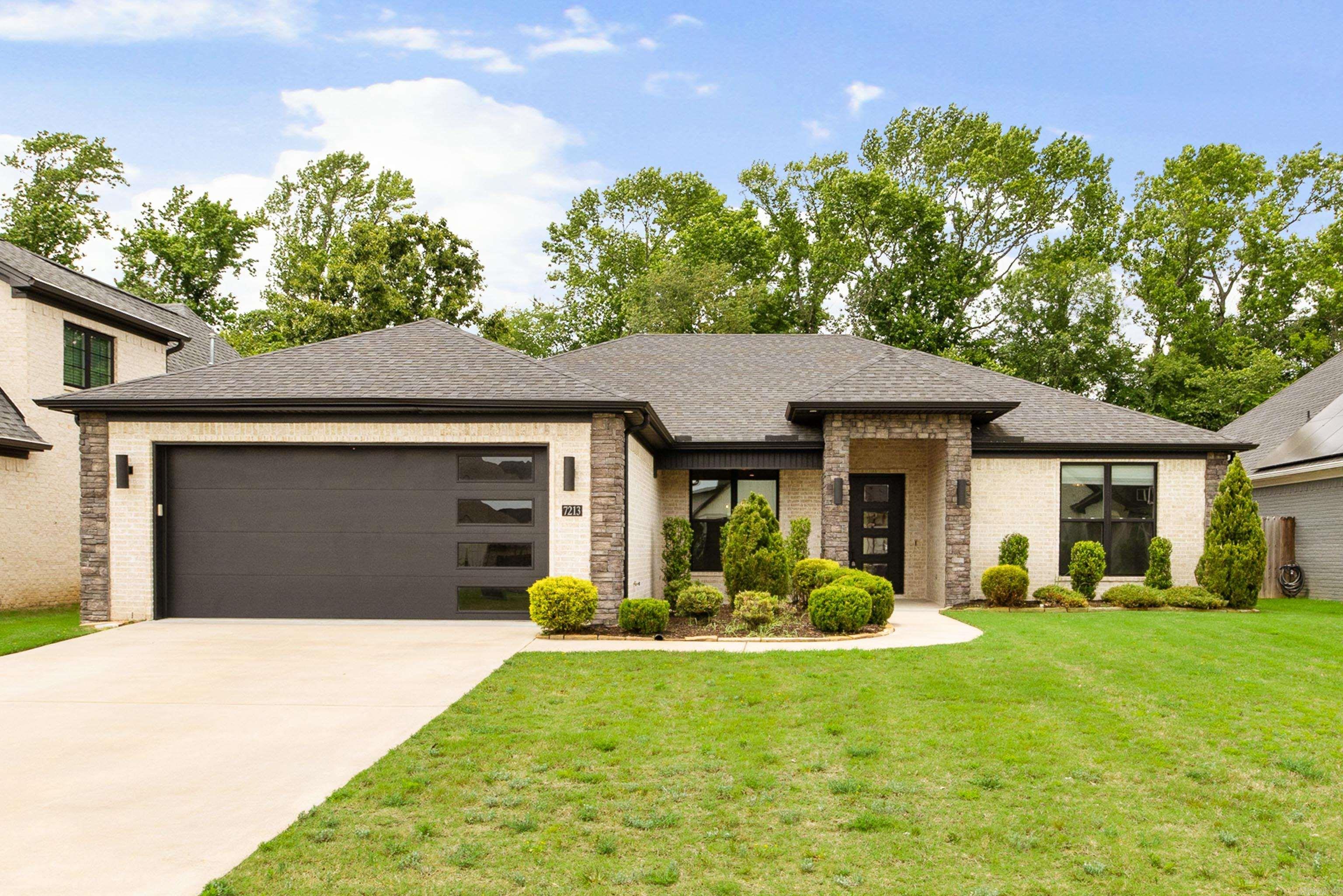 Located in The Woods of Hurricane Lake Estates, this beautiful 4-bedroom, 3-bath home features a desirable split floor plan with an open-concept design and gorgeous LVP flooring throughout the main living areas. The stunning kitchen offers beautiful marble countertops, an oversized island perfect for gathering, stainless steel appliances, a gas range, large pantry, separate dining area, and a huge picture window overlooking the backyard. The spacious primary suite includes a stand-alone soaking tub, oversized walk-in shower, and large his-and-hers closets, with one offering direct access to the laundry room. Two secondary bedrooms share a convenient Jack-and-Jill bath, and brand-new carpet adds a fresh touch to the additional bedrooms and closets. Enjoy the covered back porch overlooking a flat, fully fenced backyard that backs to the woods for added privacy, all within Bryant Schools and with NO POA dues.