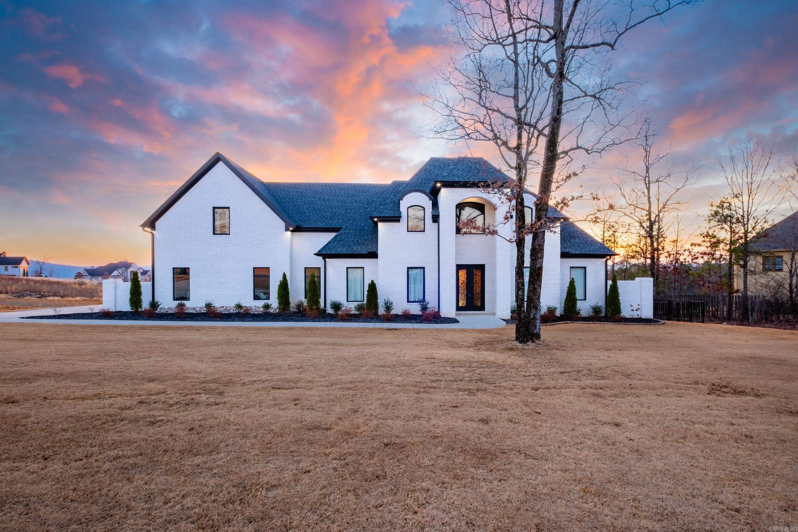 Discover a luxurious retreat that perfectly balances privacy, sophistication and a vibrant community lifestyle in Waterview Estates. This stunning 5BR/4.5BA home sits on just over a half-acre, offering serene mountain view over lake Maumelle and direct access to the neighborhood's premier amenities. Enjoy the breathtaking views of sunsets from your deck overlooking your beautifully landscaped backyard.  Backyard backs up to greenspace and is fully fenced. Open concept living spaces designed for entertaining and family fun! Gourmet kitchen with high-end appliances, expansive island and hidden walk-in pantry! Primary suite features a spa-live bath, double vanity and well oversized closet. Bonus spaces that adapt to your needs: media room, home gym or quiet study. Luxury finishes throughout.  This one is a must a must see. Agents please check "Showing Remarks".