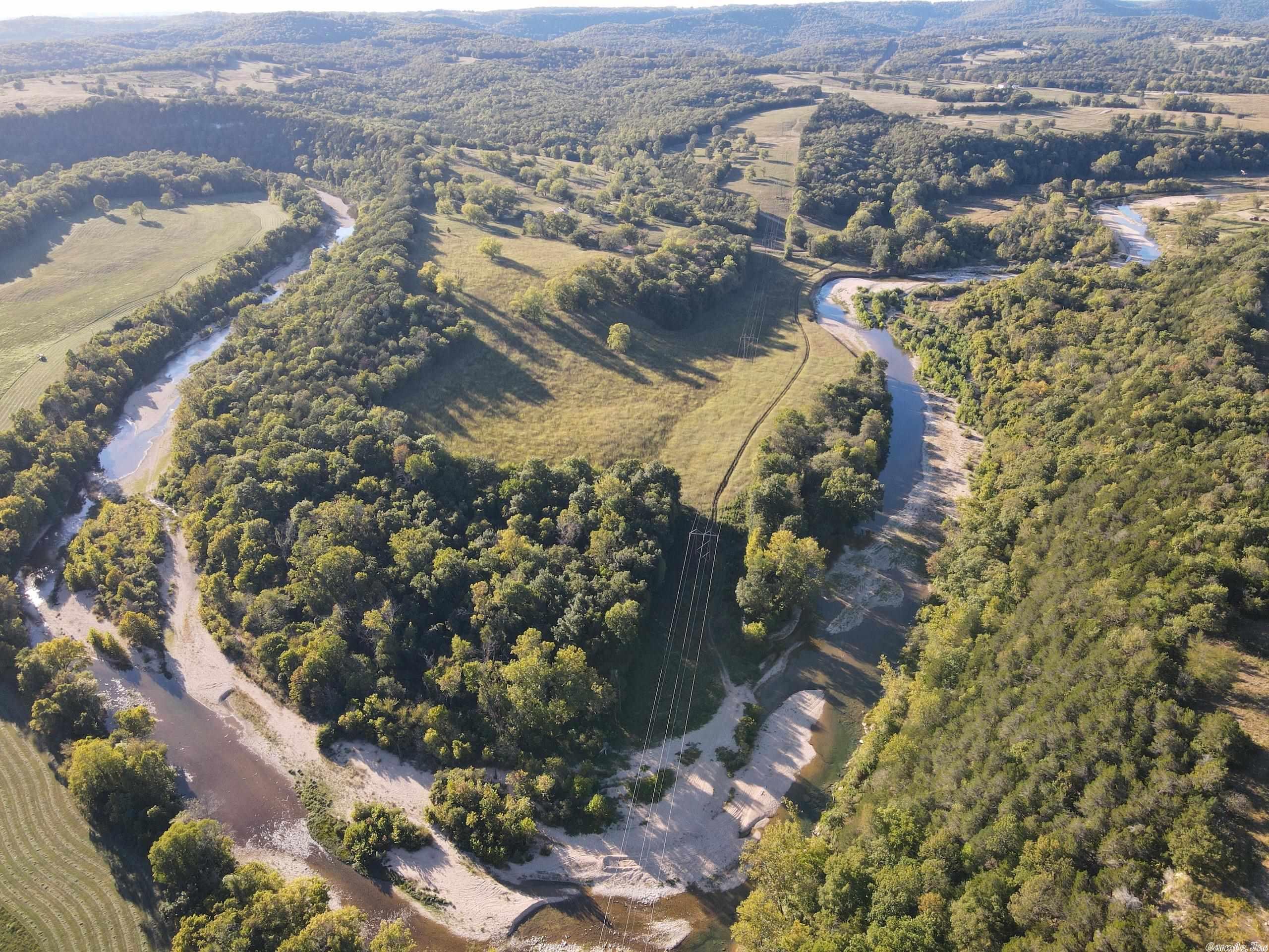 It just doesn't get any better. You won't believe this life changing property located near Bull Shoals Lake with about 3/4 mile of Bear Creek frontage. So often, a property is one-dimensional or maybe two, not this magnificent tract. From hunting to farming or recreational to investment, this place leaves nothing to be desired. Located just 1 mile off Hwy 14, the access is excellent and easy.
