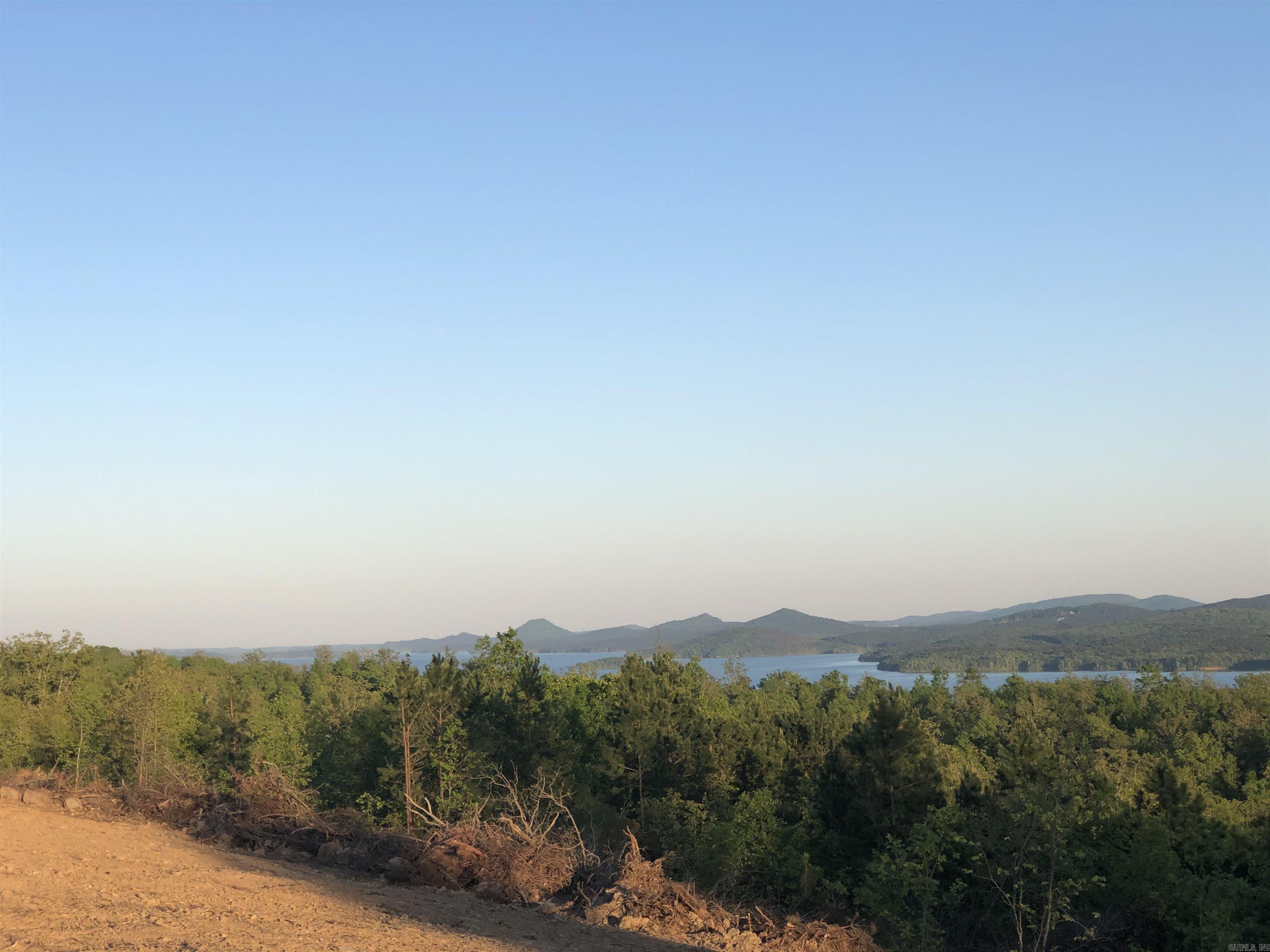 Incredible views of Lake Maumelle, Pinnacle Mountain, the Ouachita National Forest and more on flat ground inside a gated subdivision. Amenities include a walking trail system and a park area with basketball, tennis, and pickleball courts.