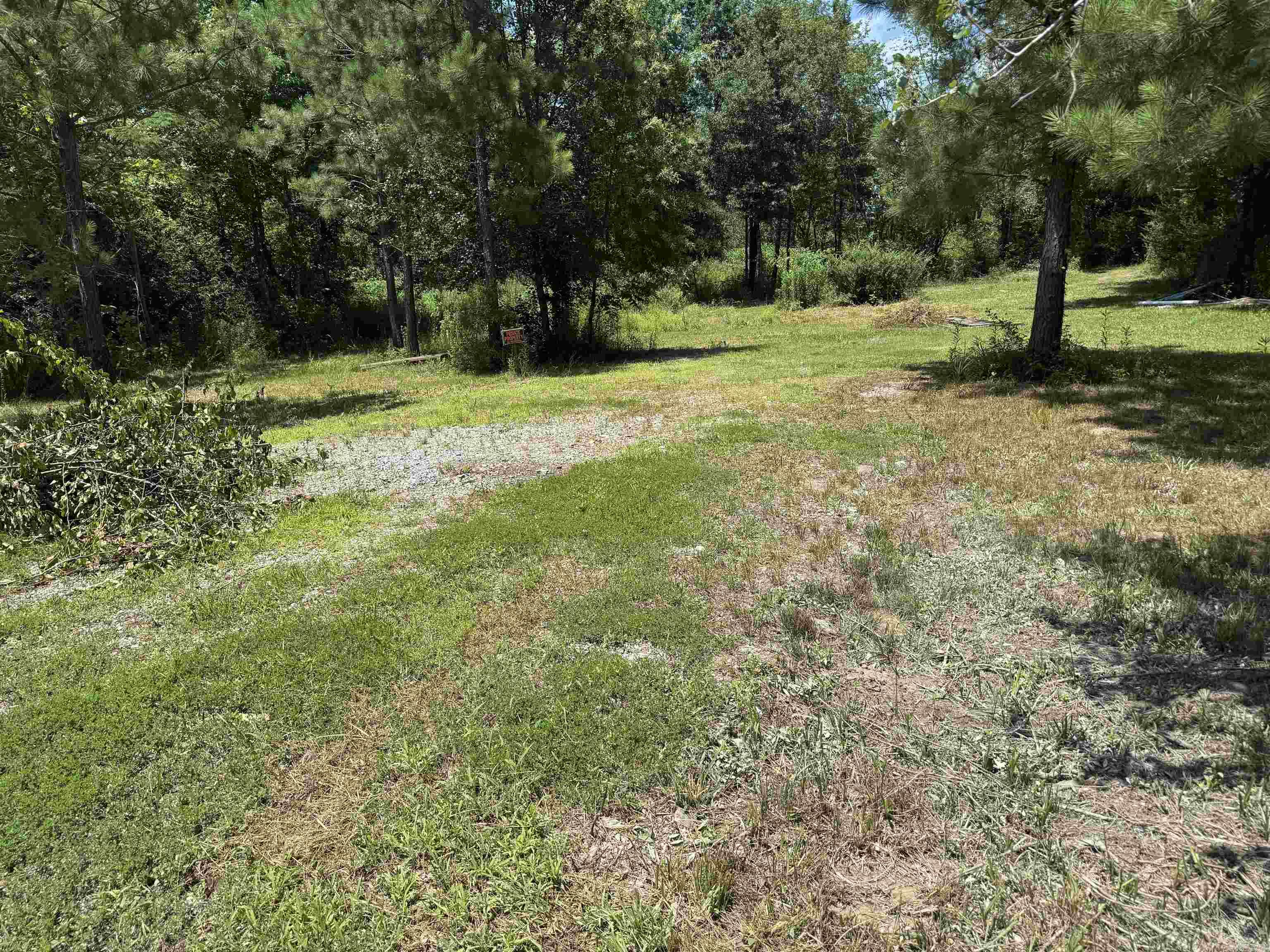 Affordable Lots with City utilities! Great Price!!! Great area just a few minutes from Lake Hamilton School!! A level lot with tree line privacy and Perfect for a starter home! 2 Minutes to family dollar and McCalister Landscaping 501 Health Club, Subway!! Very convenient Location!! Hurry to see this will not last!     No Mobile Homes, Current Seller not responsible for calling on information on water and sewer hook up. Previous owner left without info. All utility information is  buyers responsibility to verify.  Property area according to seller - North- 100.45 feet East -237.50 feet South 100.00 feet West 250.00 feet  Survey in photo is whole property the 2 lots in back are the ones for sale. Buyer responsible for their own survey.