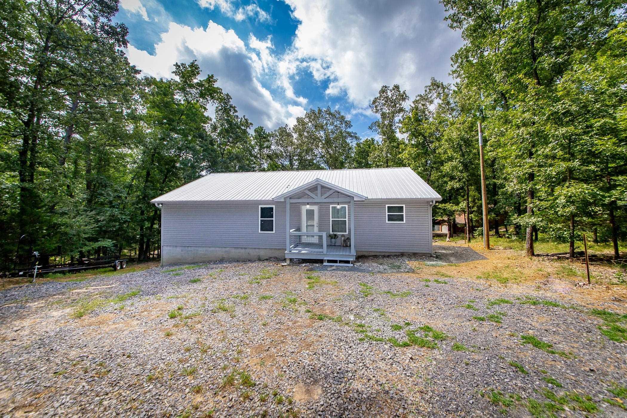 Lakefront Retreat – Modern 3 Bed, 2 Bath Home Built in 2022.Welcome to your dream lakefront escape! This beautifully maintained 3-bedroom, 2-bath home, built in 2022, offers the perfect blend of modern comfort and serene lake living. Situated on a spacious 0.73-acre lot, this property is ideal for peaceful weekends, family fun, or full-time living.Step inside to an open-concept layout with vaulted ceilings in the living room, creating a bright and airy atmosphere. The kitchen/dining area combo Additional features include: manifold system for efficient water distribution, tankless water heater for endless hot water, washer, dryer, refrigerator included, peaceful lake views and direct water access.Whether you're seeking a weekend retreat or a year-round haven, this property is a must-see. Don't miss the chance to own a piece of lakeside paradise!