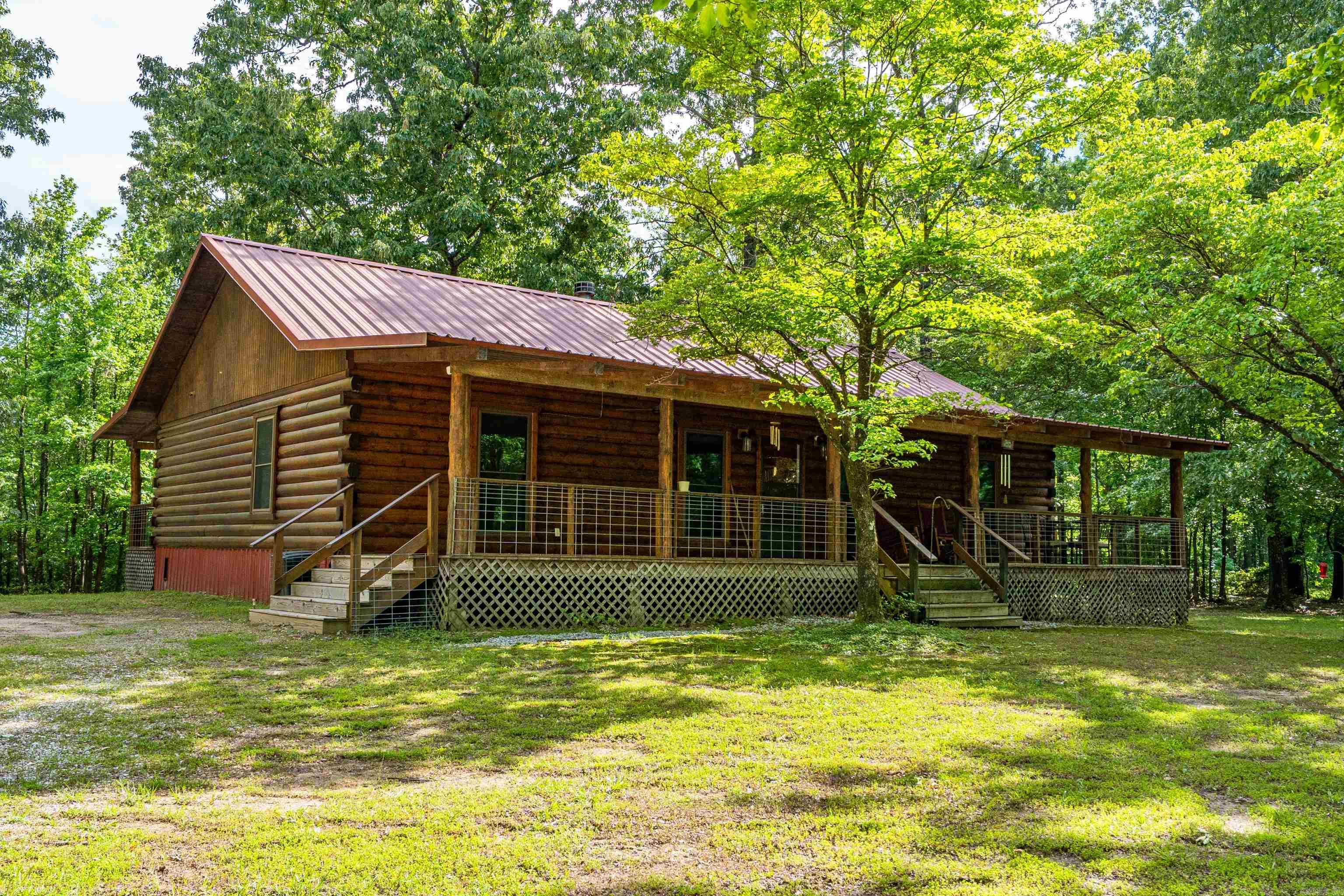 Welcome to this well-maintained log home situated on 3.5 acres approx 2.5 miles from Alpine Ridge Recreational area on Lake Degray. Ideal for a primary residence, weekend retreat or investment property. As you walk in, the rock fireplace creates a warm and inviting atmosphere. Kitchen boasts granite countertops providing durability and style. Also you cant beat a property that provides a storm shelter and  Generac whole house generator. Home comes partially furnished making it move in ready. Seller offering flooring allowance. No foundation issues. Check agent remarks.