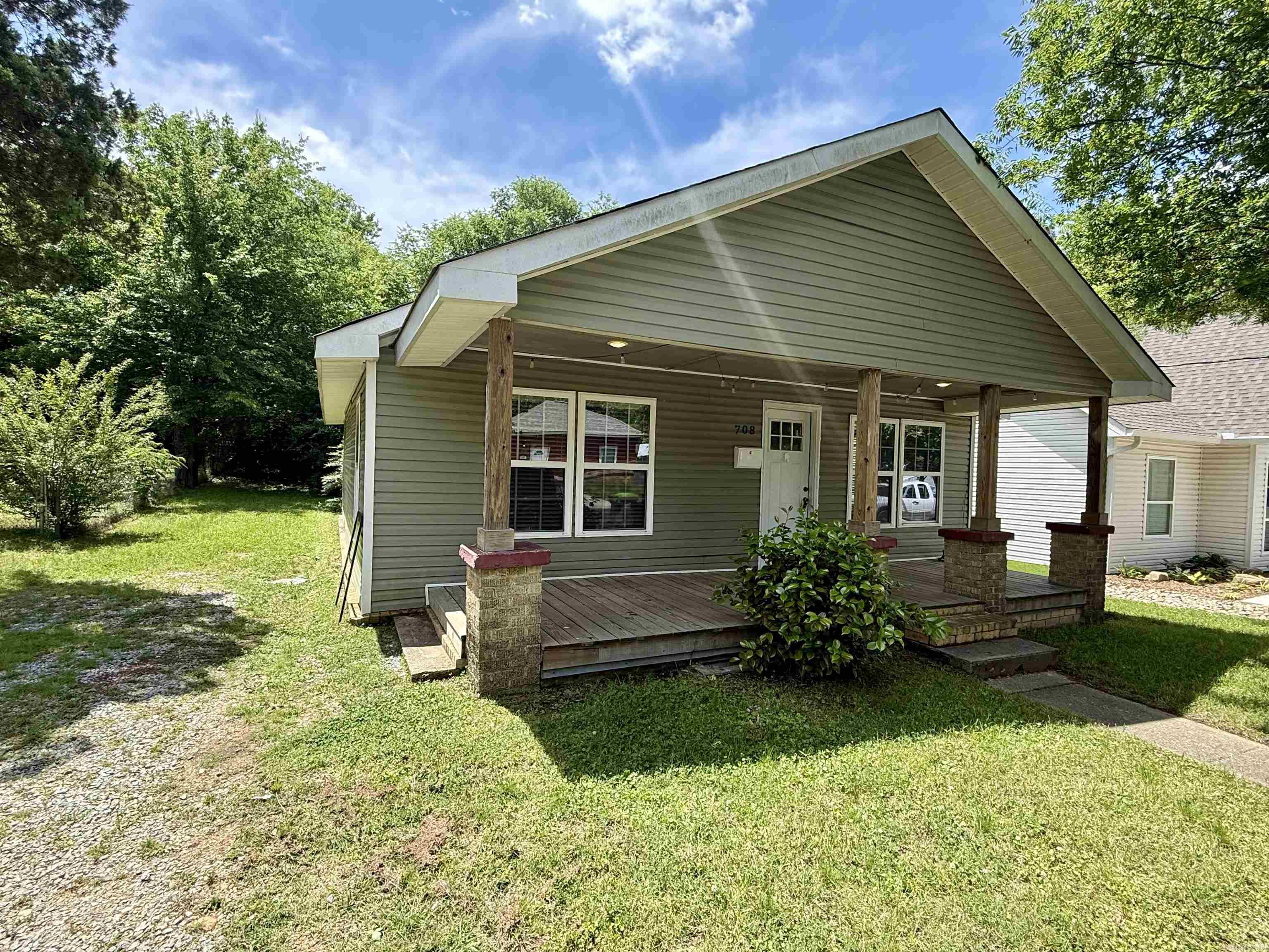 Nestled in the heart of downtown Benton, this fully remodeled two-bedroom, one-bathroom home offers a modern and luxurious living experience. The kitchen boasts granite countertops and luxury laminate throughout, complemented by the inclusion of a refrigerator, washer, and dryer in the conveyance. The new roof, HVAC system, plumbing, and electrical work were completed in 2021 and 2022. The spacious backyard and oversized front porch provide ample opportunities for outdoor living.