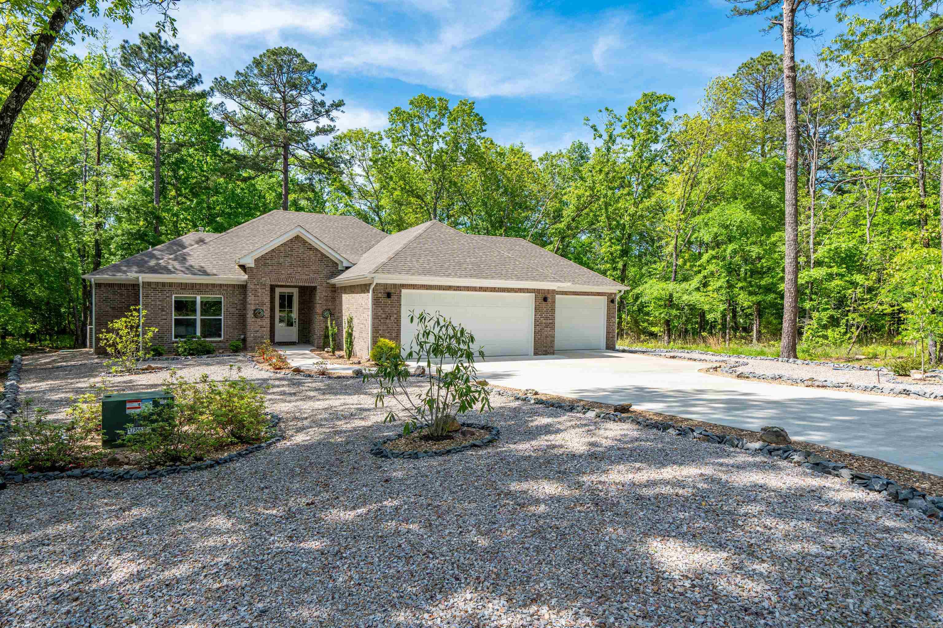 Tucked just around the corner from the Glazypeau Gate in Hot Springs Village, this beautifully crafted 2024 home offers the perfect blend of quality, comfort, and convenience. Featuring 3 bedrooms and 2 baths, thoughtfully designed layout showcases impeccable attention to detail throughout. Step inside to find no carpet anywhere, complemented by gorgeous stain-grade cabinetry that adds warmth and sophistication to every space. The home has been immaculately maintained and still feels brand new. Car enthusiasts and hobbyists will appreciate the oversized 3-car garage, offering plenty of room for vehicles, storage, or a workshop. Out back, unwind in the screened-in porch. There is easy maintenance landscaping, drought tolerant plants and a leaf guard system, making it easy to enjoy the outdoors year-round with minimal upkeep. Located in one of the most convenient areas of the Village, this home combines modern construction, high-end finishes, and low-maintenance living—all just minutes from the gate for easy access in and out. Minutes away from shopping and Highway 7. Move-in ready and built to impress—this one checks all of the boxes! Full list of upgrades available upon request.