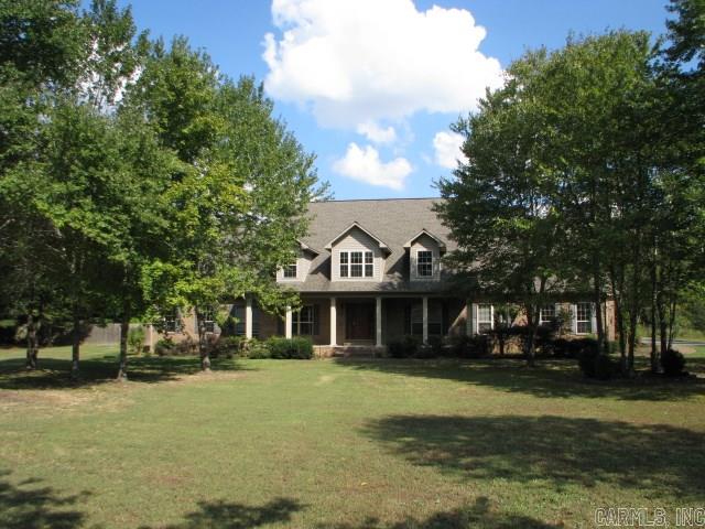 Incredibly unique! 3,958Sf in fabulous neighborhood. 2 Complete master suites; 3rd BR & 1/2 bath apart. Open floorplan; LR is just huge w/lots of light! Custom finishes & woodwork throughout; new carpet & loads of extras. Incredible built-ins, multiple walk-in closets, pantries & more! 2,000Sf guesthouse/shop in back; roughed-in for 1BR/1BA/kitchen; 18'x64" covered storage. 1.37Ac, partially fenced. Arvest employees, directors & their family members are ineligible to purchase Arvest's bank-owned properties.