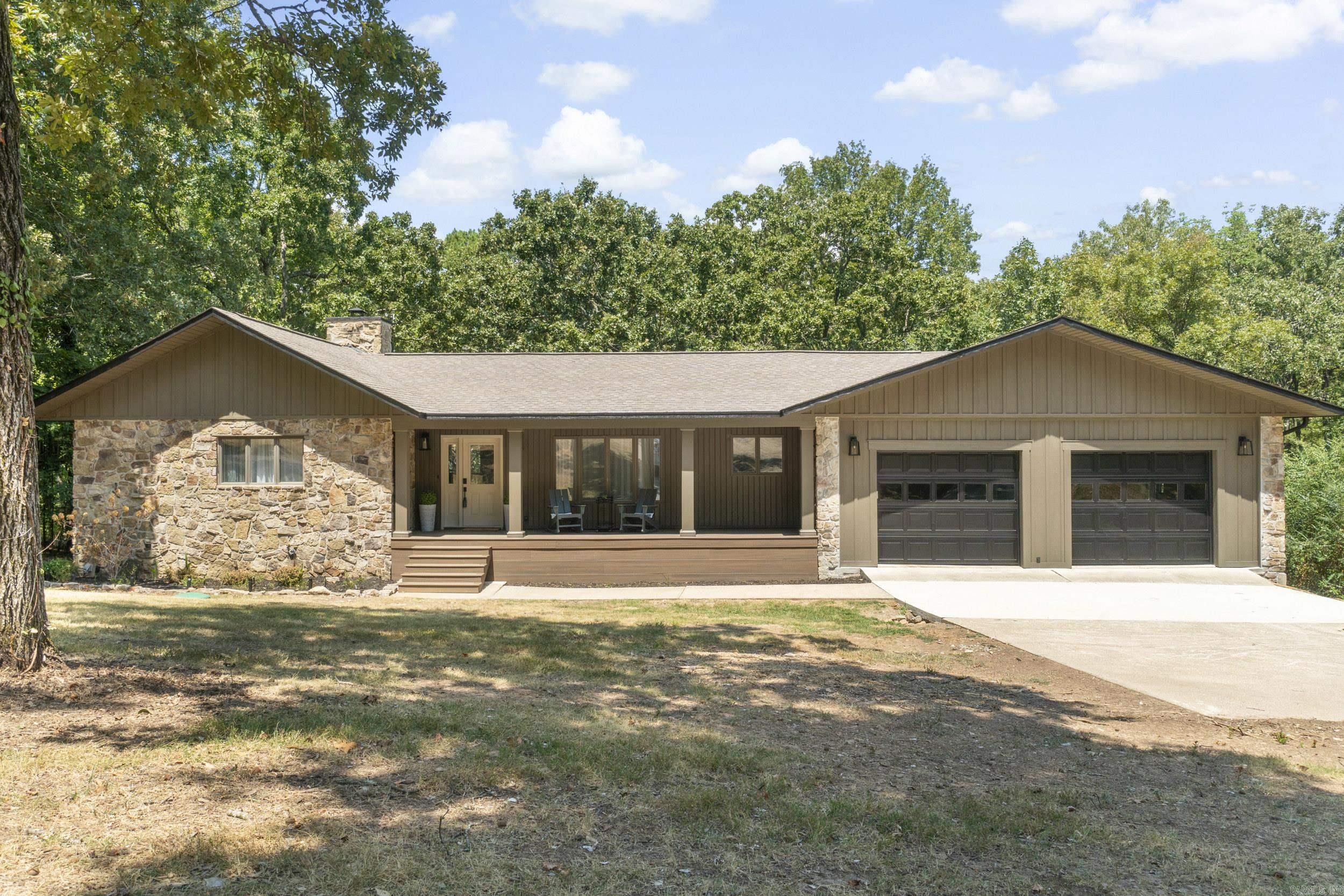 Greers Ferry Lakefront home remodeled inside & out. Heber Springs Marina, Red Apple Country Club/Golf Course & Eden Isle Marina a short drive away.The attention to detail speaks to the quality of workmanship and thought that went into bringing this 1987 home up to meet the needs of modern living in 2026. Open concept living space on the main level of the home speaks to easy living and entertaining. Native stone fireplace, vaulted ceiling, and wall of glass leading to a large covered deck overlooking the lake & backyard firepit. Walkout basement level boasting a Den, a bonus room, and 3 Bedrooms. The master suite is located on the main level. Plenty of room for family & friends in this 3836 SF lake home. 31 x 36.9 dream garage for all your lake toys. SEE ASSOCIATED DOCUMENTS for larger floor plan and detailed information.