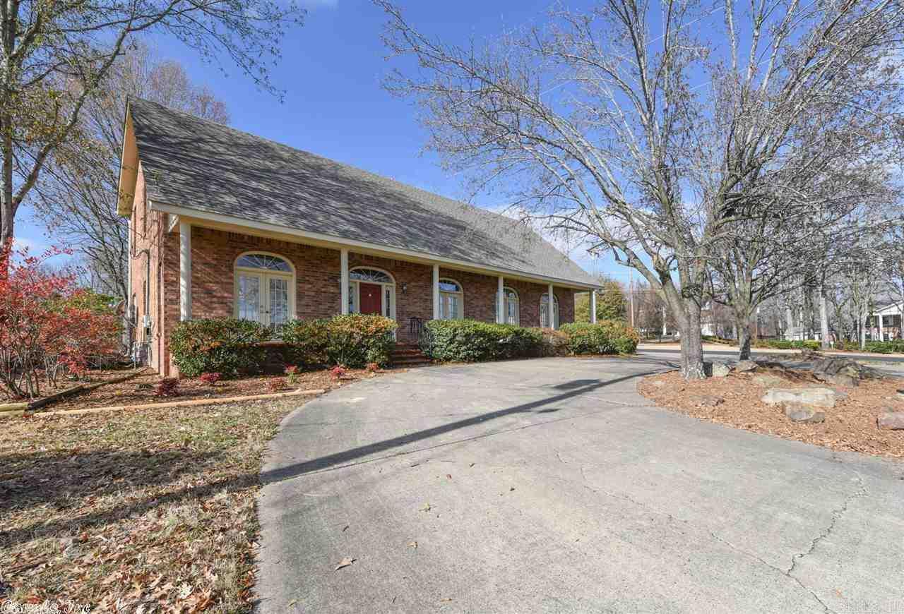 Spacious all brick home, large corner lot, golf course frontage! 3 BR upstairs with own living room and fireplace. Master down OR up, all large rooms, bathrooms and closets! Cozy family room w/ fireplace. Fresh paint/carpet throughout. Water heater & cook top 2018. Refrigerator conveys. Breakfast bar in kitchen + separate formal dining. Rear deck/patio overlook 13th green of Greens at North Hills golf course. Side entry garage & circle drive in front, large corner lot. New roof 2015. See remarks!