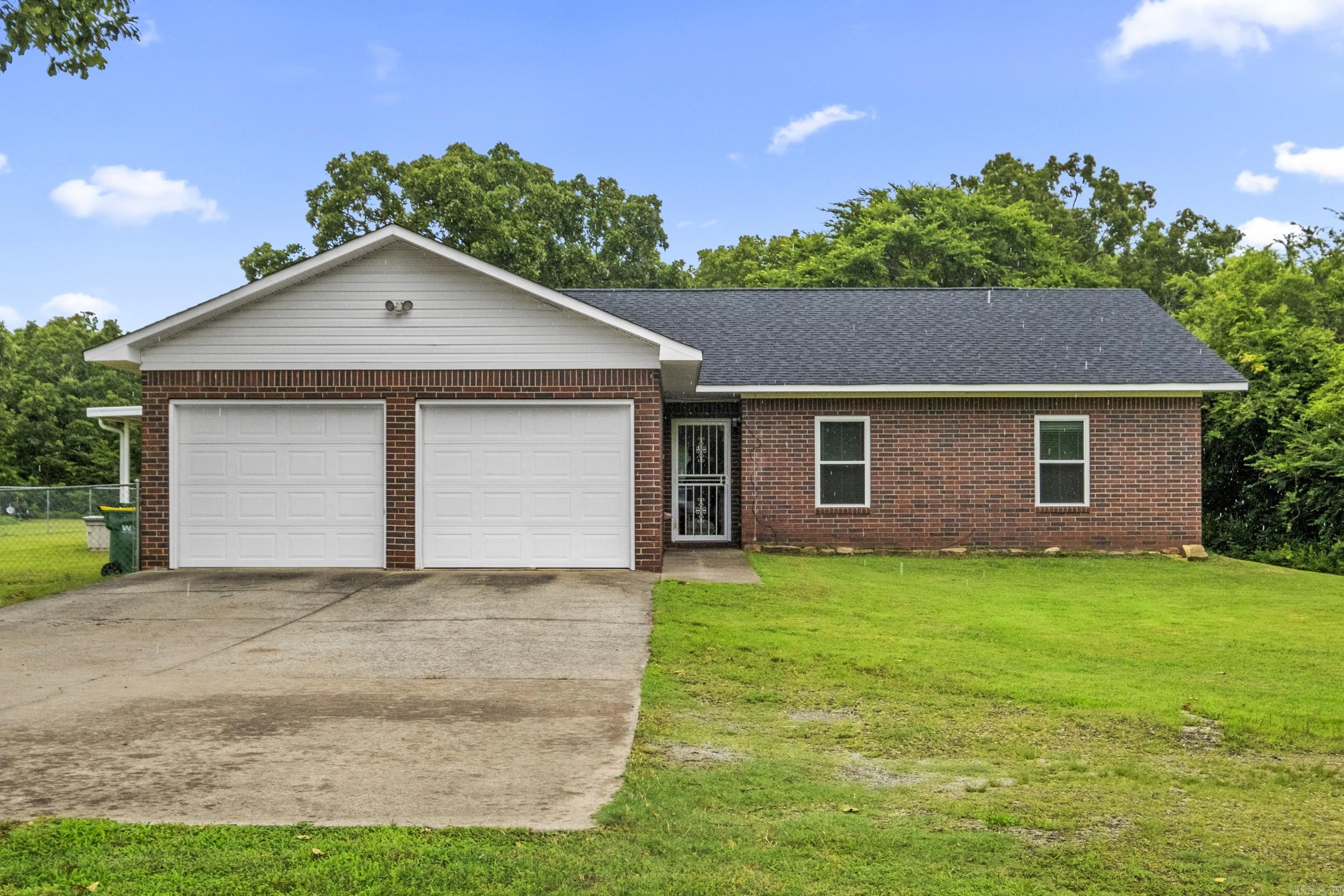 Enjoy peaceful country living just minutes from the backgate of the LRAFB! This beautifully maintained 3 bedroom, 2 bath home sits on 4.09 acres and offers a perfect blend of comfort and functionality. Inside, you'll find an inviting layout with well-kept interiors, spacious living areas and plenty of natural light. Outside features a lovely covered porch that is great for early morning coffee in nature! There is also a generous storage building and room to explore.   This home offers a unique opportunity for multi-generational living as it is located next door to another new listing - making it ideal for extended family or mother-in-law setup.   Don't miss the opportunity for acreage living with convenient access to town! Schedule your showing today!