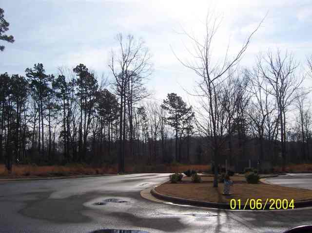 Property offers 2.9 acre "L" shaped lot with 142' of frontage on Maumelle Blvd and 252' of frontage on Country Club Parkway. Situated at a stoplight intersection and can be subdivided. Subject to an access easement for ingress and egress and parking. Grantor is vested with authority to approve improvements, including designs. Zoned C-3. *SALE IS FOR 1.279 ACRES*