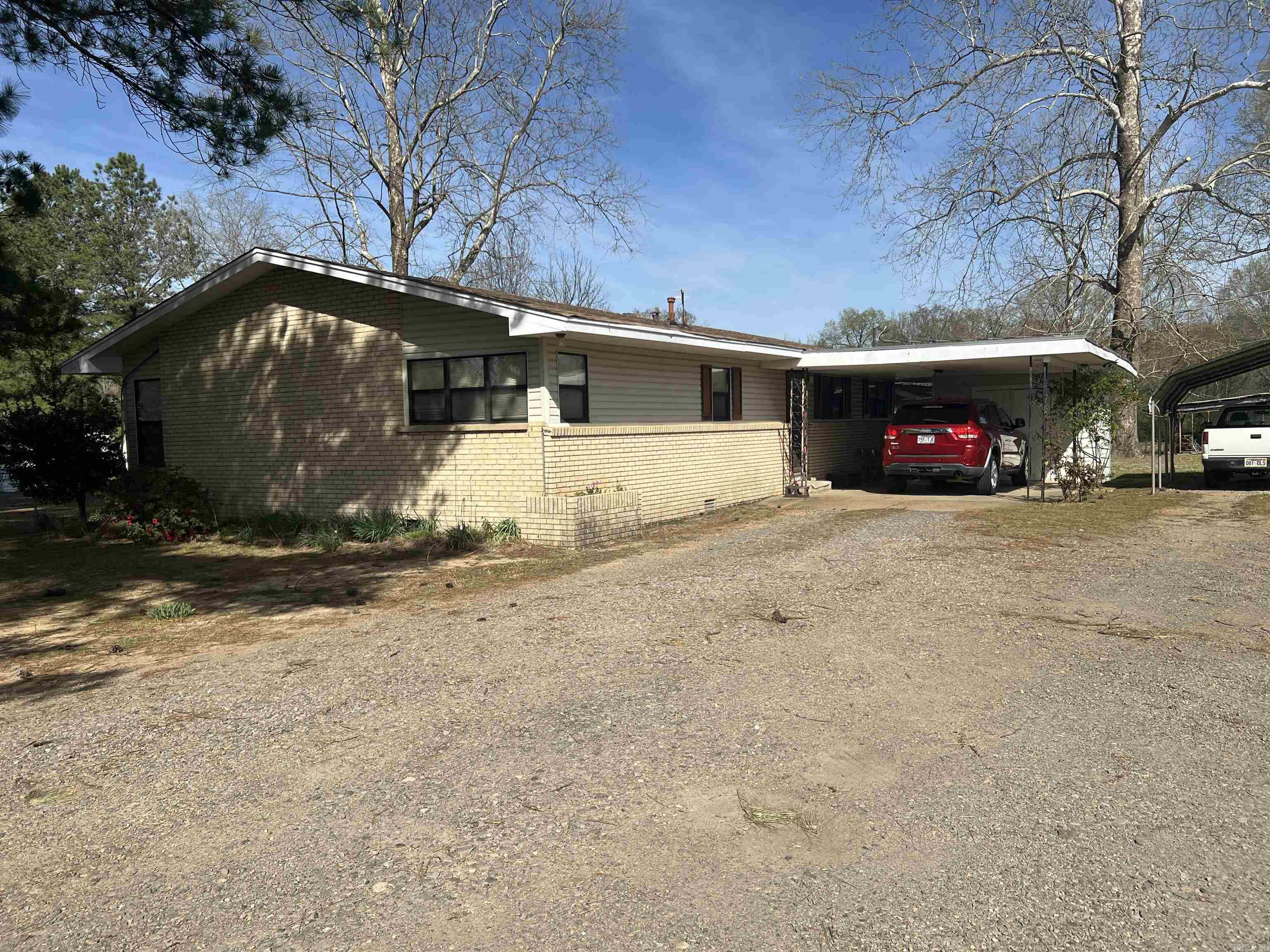 Very nice home on 2 acres, only 2 miles from I40. This home features a large great room with insert in FP, dining area, kitchen has an island, stained cabinets, large pantry and breakfast area. There are 3 bedrooms & 2 baths. This home has a large workshop, and a well house but, has city water and septic. It offers great pasture land fenced. It is very close to Lake Overcup so fishing is a short drive or walk.  Home to be sold "AS IS"  No SPD