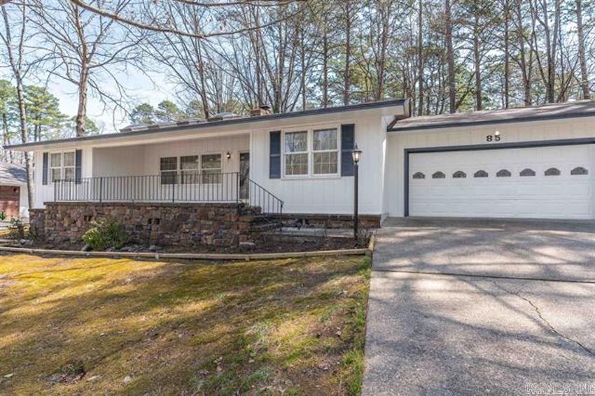 3 minutes from West Gate.  Enjoy this nice weather from the spacious front porch! The single level home has 3 bedrooms, 2 baths, Arkansas room, 2 car garage, wood burning fireplace, and fenced back yard. There is common property behind it to create a park like sitting. Laminate flooring throughout the house.  Bathrooms has been updated.  New kitchen refrigerator to convey.