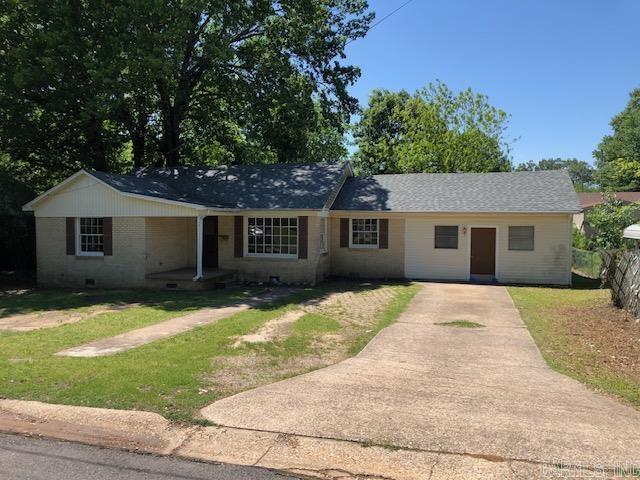 Fantastic investment or starter home opportunity! This ideally located vintage charmer is located in the heart of Downtown Benton within walking distance to Tyndall Park! Enjoy charm galore with refinished original hardwood floors and an abundance of natural light. Enjoy 4 spacious bedrooms and two full bathrooms as well as a converted garage area that could be great storage, or possibly even a secondary living area with a little imagination. The ample sized backyard features gorgeous mature trees for shade and beauty. Whether you want to rent the home out (used as a rental for many years) or make it your own, the opportunities are endless! Home to be sold as-is, where-is.  Agents, please see remarks for offers.