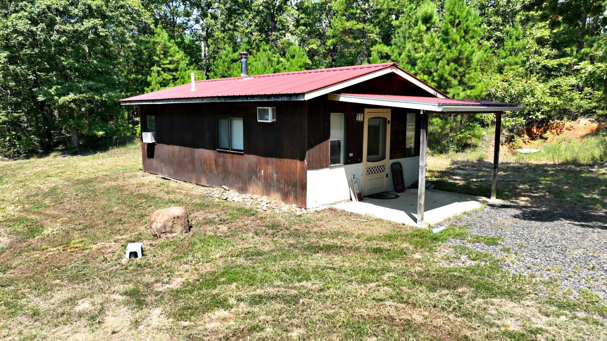 Escape to your own slice of the mountains with this small home on 3.6 acres, ready for you to finish and make your own! Studio-style open living and sleeping area, perfect for a simple mountain retreat or weekend getaway. Featuring a full bath and laundry area with instant hot water already installed, plus a 40’ RV that conveys with the property, this place is full of potential. All utilities are in place, including a 200-amp service, making it move-in ready as a getaway or a long-term project. Enjoy mountain views, trails throughout the property, and the convenience of being close to town and Forest Service land. Some building materials will also convey, giving you a head start on finishing touches. Whether you’re looking for a private retreat, a weekend escape, or a property to expand on, this spot offers endless opportunities!