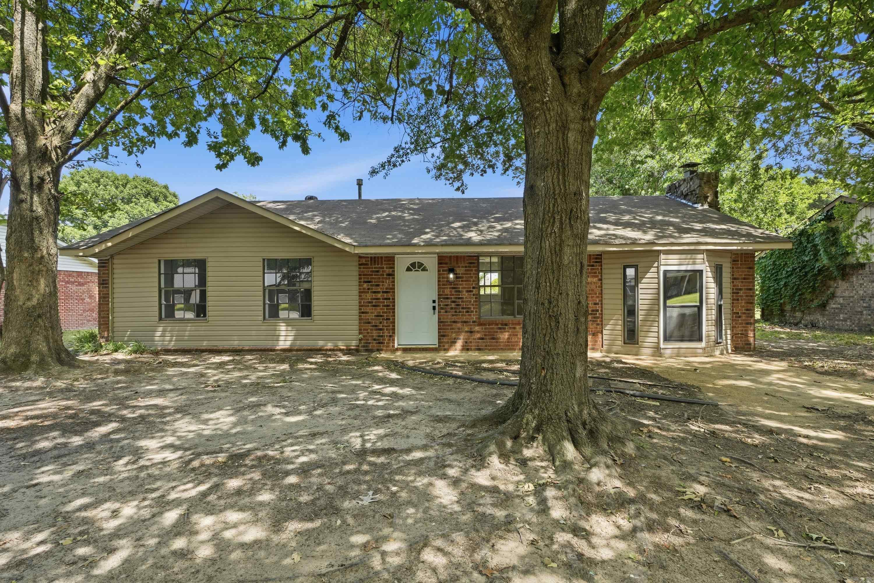 Great home on a beautiful tree-lined street in Bay. The 3 bed/1 bath home has tile floors which make for easy maintenance. Two living areas, including a nice family room with a fireplace (buyer to verify fireplace functionality. Pictures of fireplace working are virtually staged). The family room features nice windows that let in just the right amount of natural light. There's a large storage area off the family room as well. The bathroom features a shower/tub combo. Out back, you'll find a concrete patio that's great for grilling, and a large back yard. Great location with easy access to Jonesboro! Some photos are virtually staged.