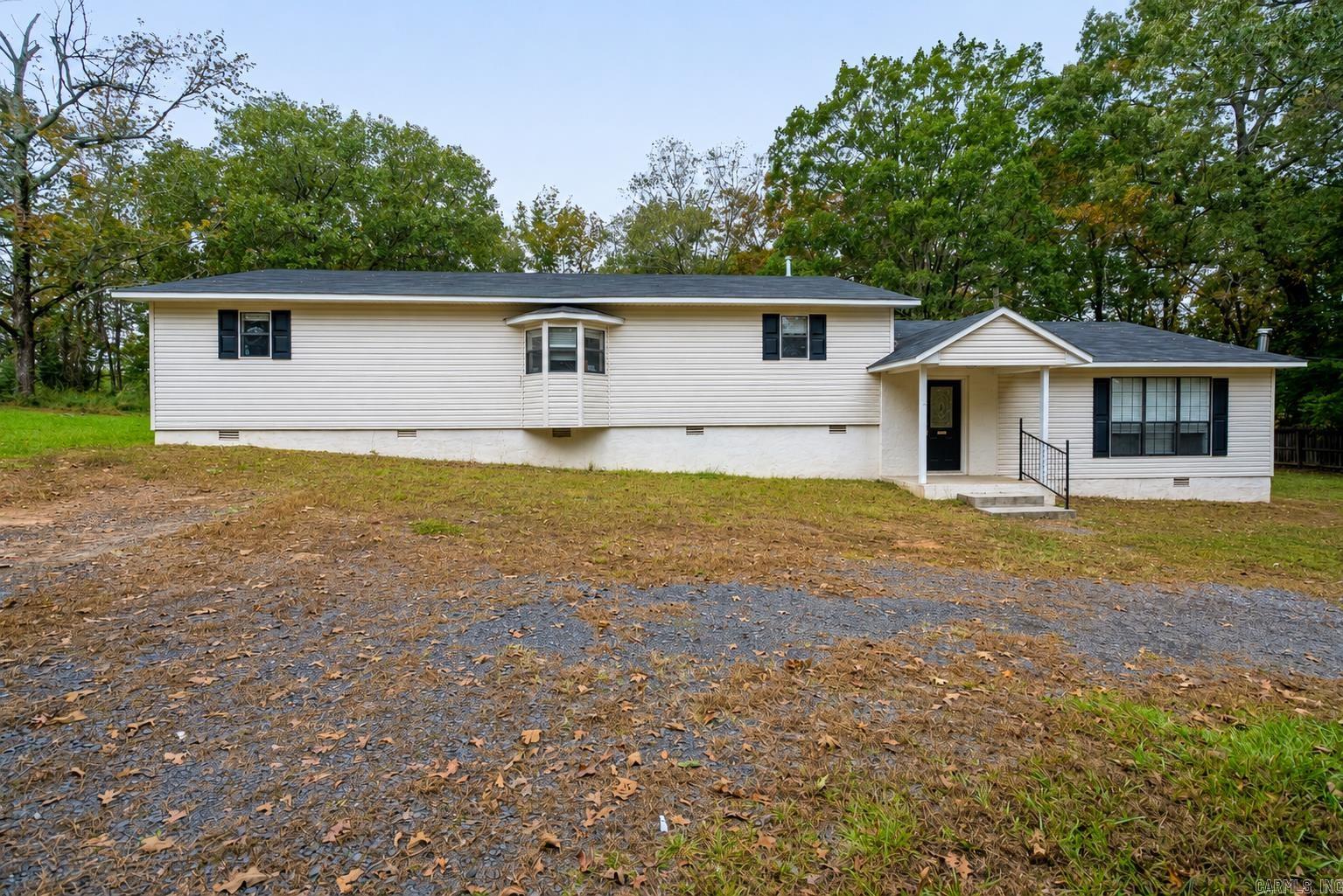 Come take a look at this spacious 3-bedroom, 2-bath home offering 2,464 square feet of living space on approximately 0.73 acres. This property features an open-concept floor plan connecting the living, dining, and kitchen areas—ideal for both everyday living and entertaining. The primary suite includes a private bath, ample closet space, and access to a separate deck. Two additional, large bedrooms provide flexibility for guests or office space. Exterior highlights include a large yard with room for outdoor activities, gardening, or future improvements. Conveniently located near major commuting routes, with easy access to nearby amenities, shopping, and dining. Schedule your showing to explore the potential this property has to offer. * Agents see remarks