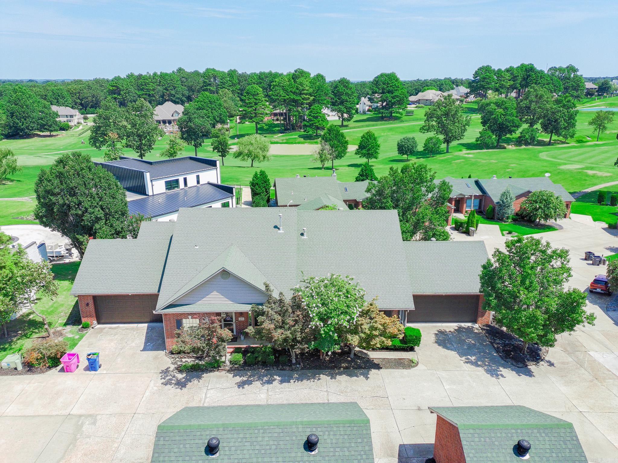 Welcome home to 4000 RidgePointe Cove, a 2-bedroom 2 bath condo in the prestigious RidgePointe Country Club neighborhood. This beautifully updated condo features hard surface flooring throughout, for easy cleaning and maintenance. The living room showcases a gas log fireplace, perfect for cozy evenings. With clean white cabinetry and granite countertops, the kitchen is sure to please any chef. The primary bedroom closet doubles as a storm/safe room. Parking is no issue here with an oversized 2-car garage and 2 parking spaces outside of the garage. Enjoy the outdoor space on your screened-in front porch or the back patio, overlooking the picturesque golf course. Take advantage of the amenities RidgePointe County Club offers: indoor and outdoor tennis, a swimming pool, a gym, an 18-hole golf course, and two restaurants. The water heater was just replaced in 2024. Call today for your private showing of this luxury RidgePointe condo!