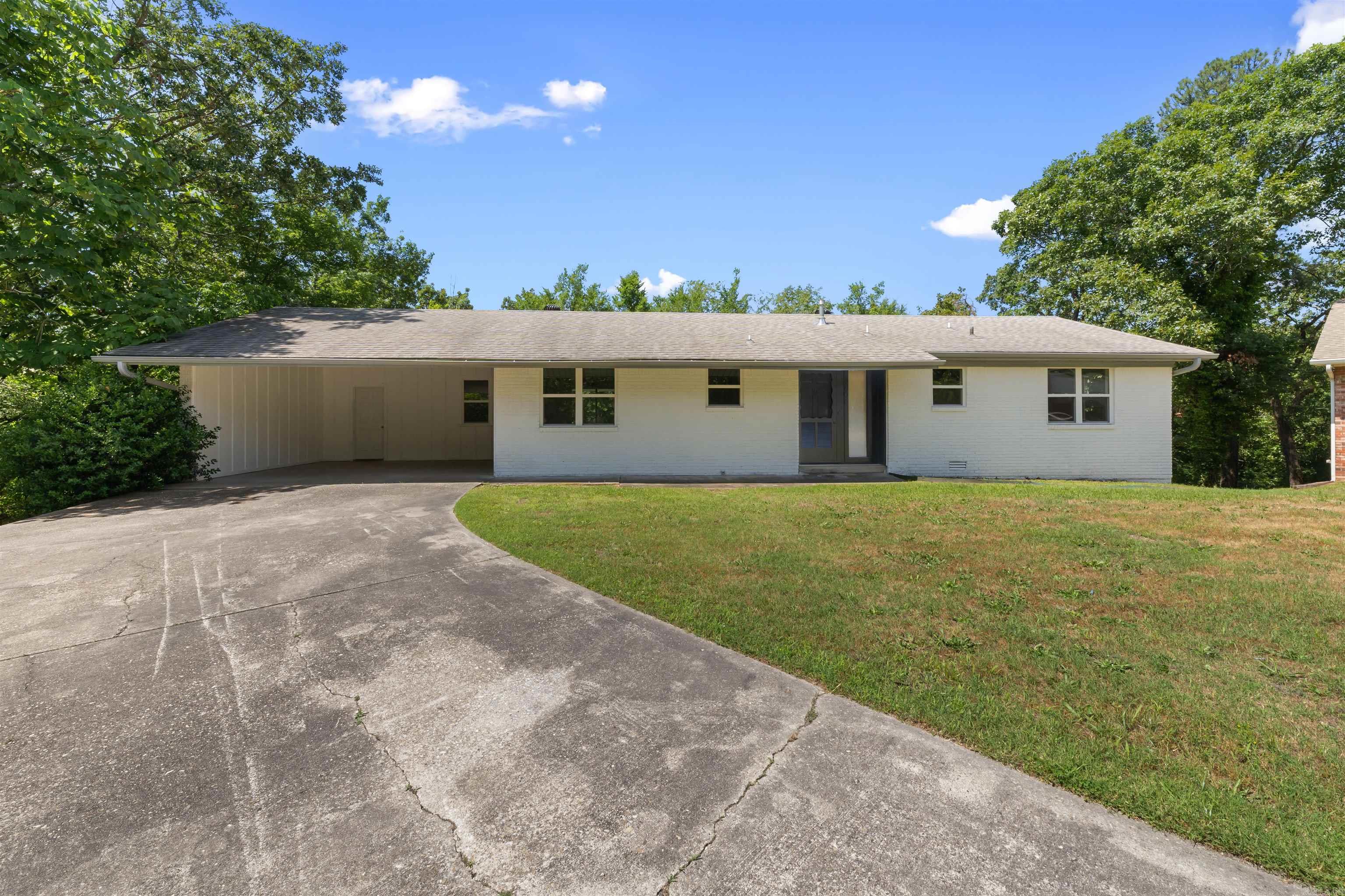 Beautifully Updated Home that sits on 1.10 acre lot in the Park Hill Subdivision of North Little Rock with Access to all Amenities. 4 Bedrooms / 3 Full Bathrooms / 2 Living Areas / Office / Storage Room. All New Windows Throughout. Main Floor Boasts Totally Remodeled Kitchen w/ New Cabinets, Fixtures, Granite Countertops and All New Stainless Steel Appliances! Living Room. Office. Master Bedroom with a Totally Remodeled Bathroom which includes a Titled Walk-In Shower.  Another Full Bedroom & Fully Remodeled Bathroom upstairs.  Downstairs has its own Living Space. Two Bedrooms. The 3rd Fully Remodeled Bathroom. Large Laundry Room.  Spacious Backyard with a Covered Patio and Storage Building. Storage Room in the Carport.  Call to Setup a Showing Today.