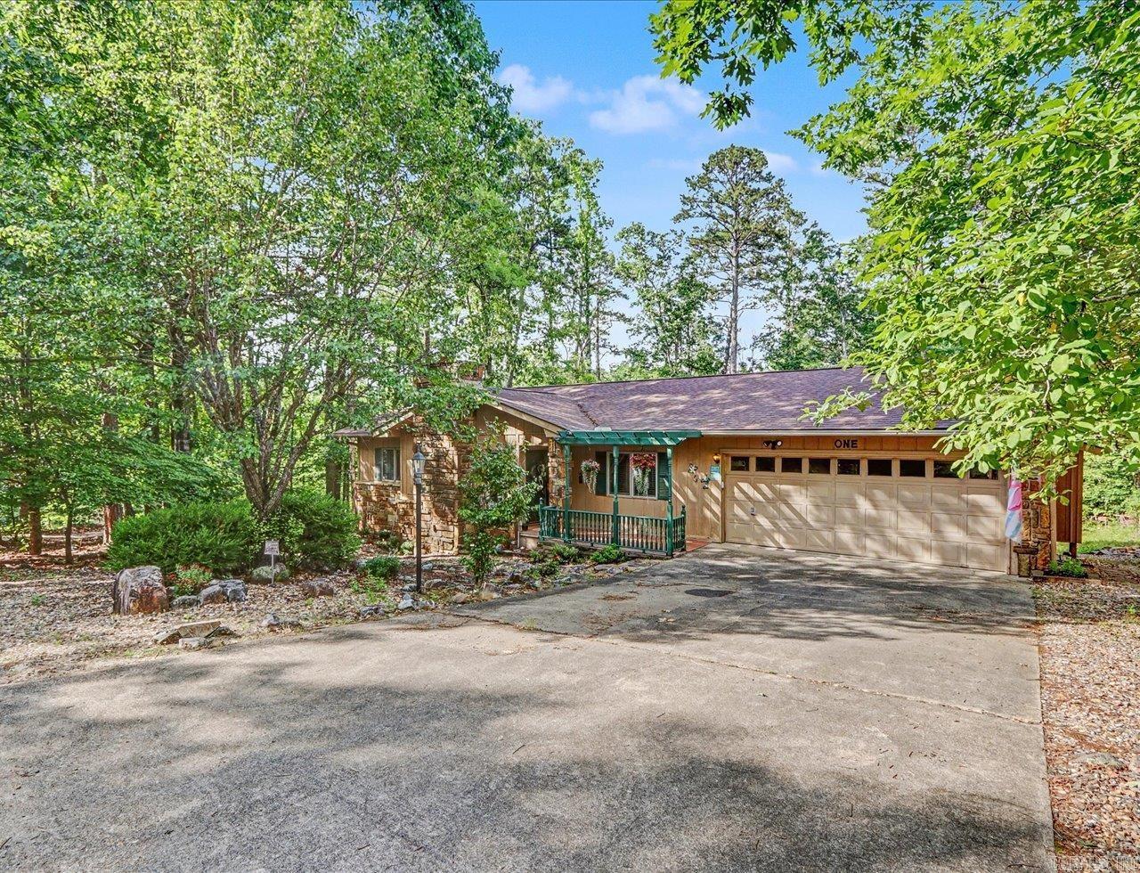 Welcome home to this beautifully updated 3-bedroom, 2-bathroom gem, perfectly blending rustic curb appeal with modern convenience. Boasting 1,453 sq. ft. of living space and a 2-car garage, this home features a stunning wood and rock exterior that fits beautifully into its natural surroundings. Step inside to find a thoughtfully modernized interior. The kitchen is a delight, featuring a brand-new infusion stove/oven, new sink, and disposal, alongside updated cabinets and fixtures. You’ll find those same tasteful cabinet and fixture updates carried throughout the laundry room and both bathrooms. The primary bath has also been enhanced with a luxury bidet toilet. Outdoor & Mechanical Highlights: •The Ultimate Workshop: The lot has been cleared (30 trees removed) to make room for 12 x 20 workshop/shed—ideal for hobbies, storage, or a detached office. Lower area has a separate workshop. •Peace of Mind: Equipped with a full-house generator, ensuring you never have to worry about power outages.  This turnkey property offers the perfect balance of functional workspace, modern luxury, and everyday reliability. New residents to HSV subject to $2,000 buy-in fee. AGENTS SEE REMARKS.