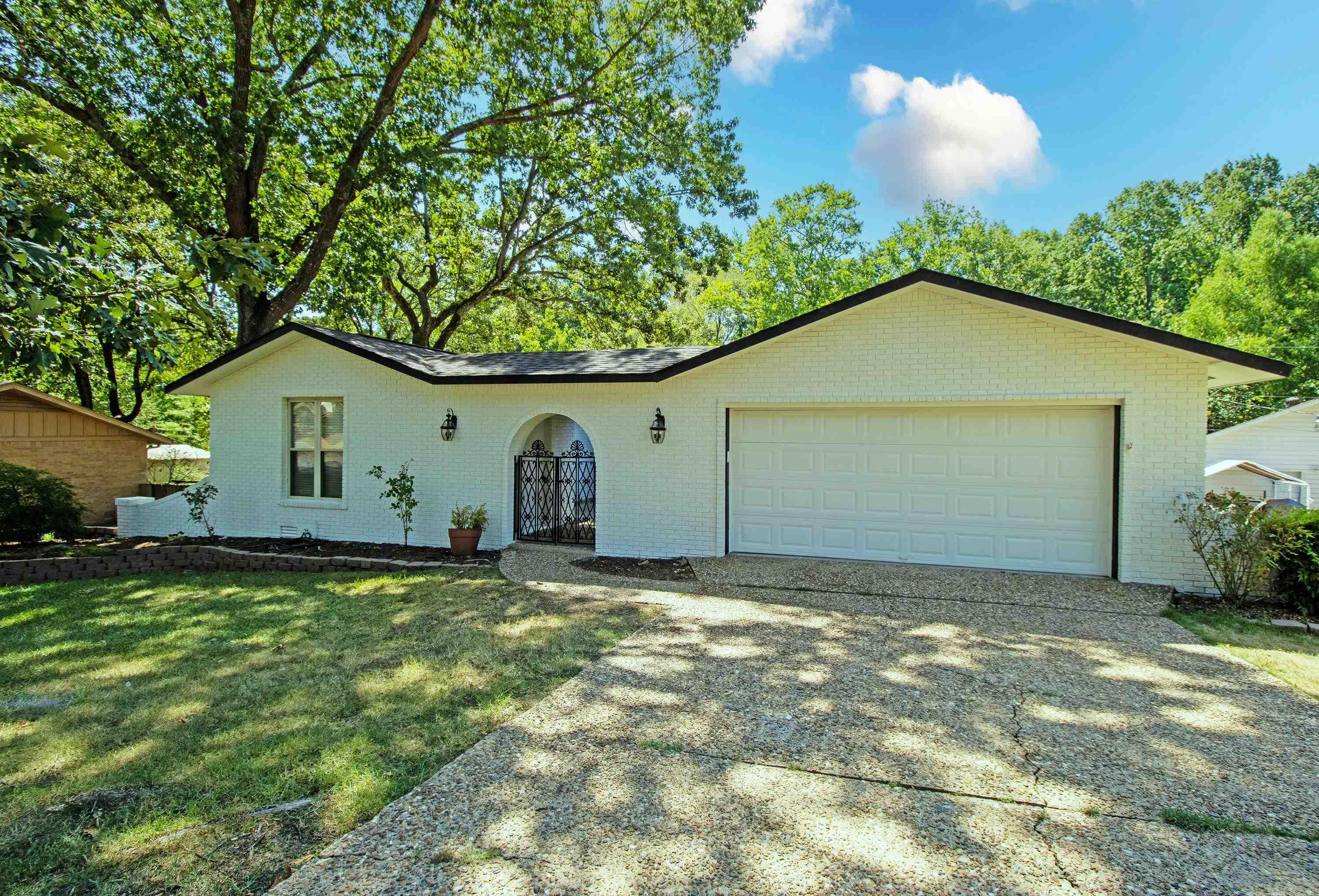 Come find your oasis in the middle of Sherwood! Located only minutes from a golf course, shopping, dining and highway access. This home backs up to green space and has all the updates you have been looking for! Chef's kitchen with custom fridge, soft close custom cabinets, viking gas range and granite countertops, fireplace and more! New roof in 2013, new HVAC 2019, complete remodel with fresh exterior paint and new deck in 2022! Downstairs could be gameroom/bonus room or fourth bedroom! Don't miss it!