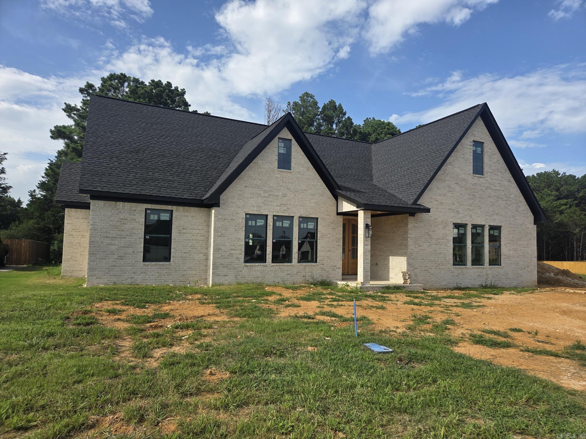 Come see this amazingly large space in the open living, dining & side kitchen! This NEW CONSTRUCTION custom house has a vaulted ceiling & gas log fireplace in the living area with custom cabinets, quartz countertops & glass top upper cabinets with a walk-in pantry in the corner & custom white oak island & breakfast bar. The split guest rooms have a jack-n-jill bath between them with walk in closets. The main bedroom has attached on suite with large custom shower, dual sinks, walk in closet that leads to the separate laundry. The covered back patio faces the tree line for privacy with a good-sized back yard after the trees are trimmed.  See agent remarks!